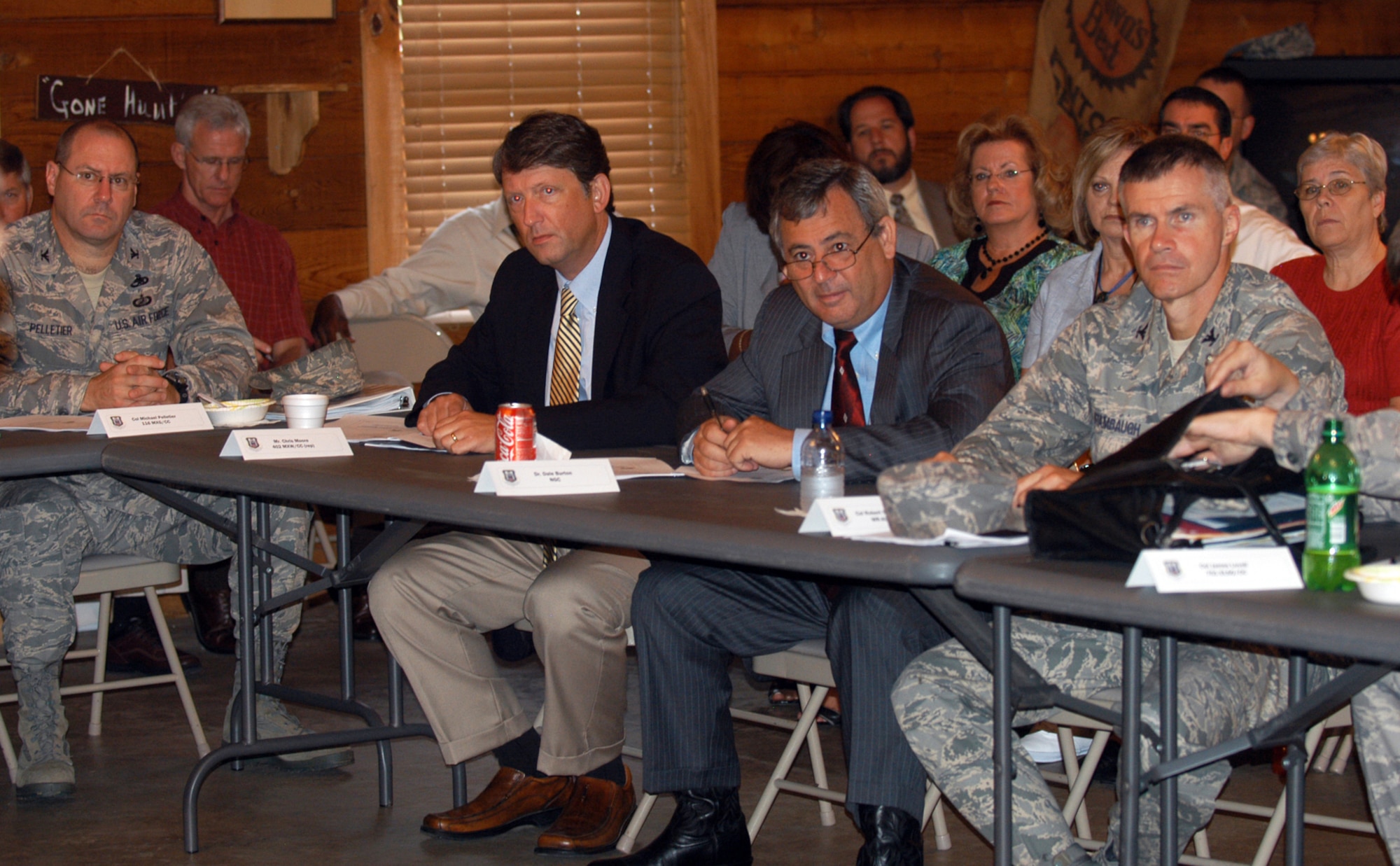 Various Team Robins members, including Col. Robert Stanbaugh (far right), Warner Robins Air Logistics Center vice commander, and partnering representatives listen to a briefing at the Long Range Memorandum of Agreement Partnering Review Aug. 12. (U. S. Air Force photo by Sue Sapp)