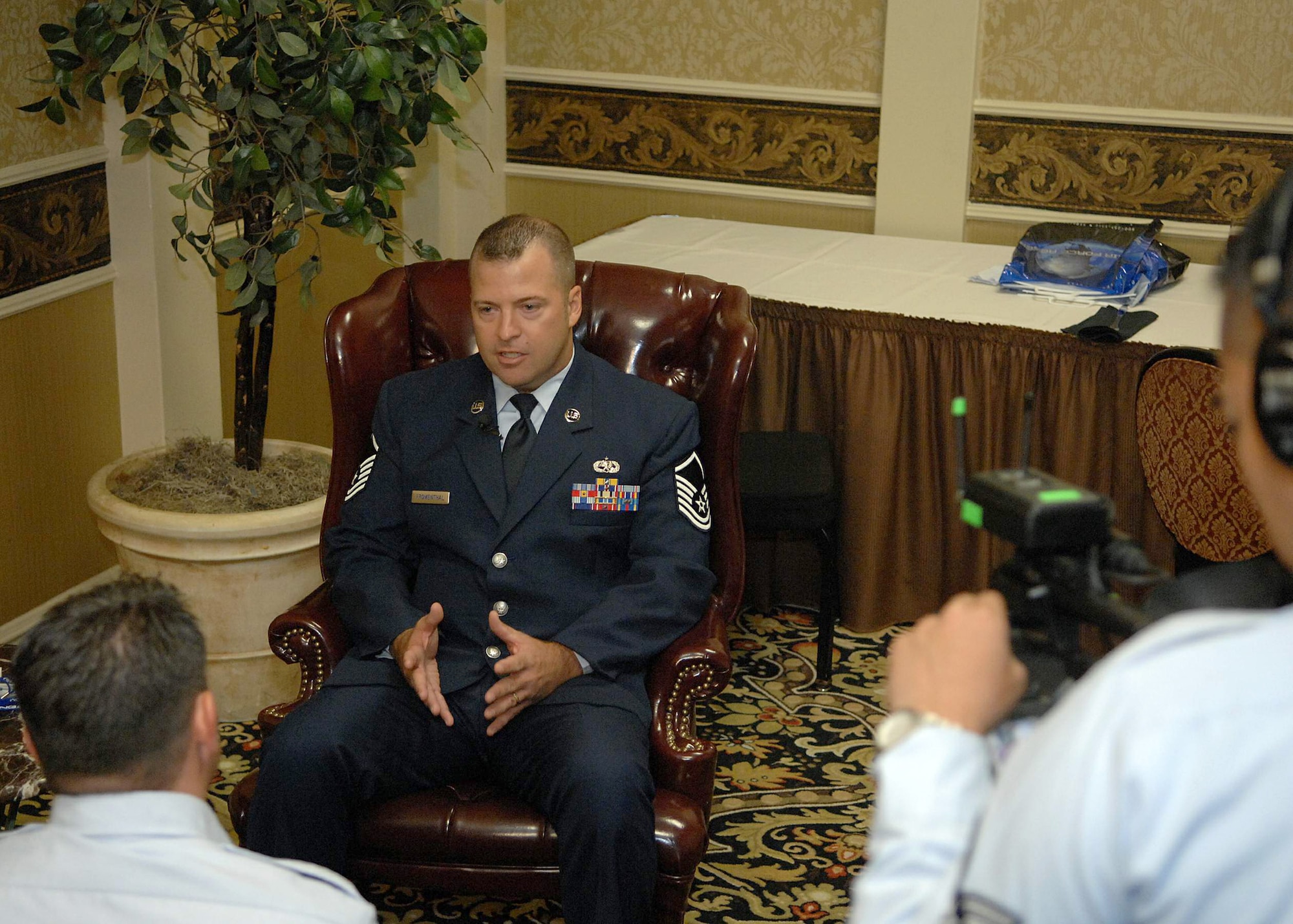 Master Sgt. Derek Fromenthal is interviewed by Staff Sgt. Robert Hyman and Senior Airman Jonathan Garcia, from the 4th Combat Camera Squadron, after Sergeant Fromenthal was awarded the Chief Master Sgt. Fred Archer Award during the annual Tuskegee Airmen, Inc. convention in Las Vegas, Aug. 7. The award is named for the Air Force's first African-American chief master sergeant. Tuskegee Airmen, Inc. is a non-profit organization dedicated to honoring the accomplishments of African-Americans who participated in air and ground crew and operations support in the Army Air Corps during World War II. Sergeant Fromenthal is from the 5th Combat Communications Group at Robins Air Force Base, Ga. (U.S. Air Force photo/Staff Sgt. Stephen Schester)