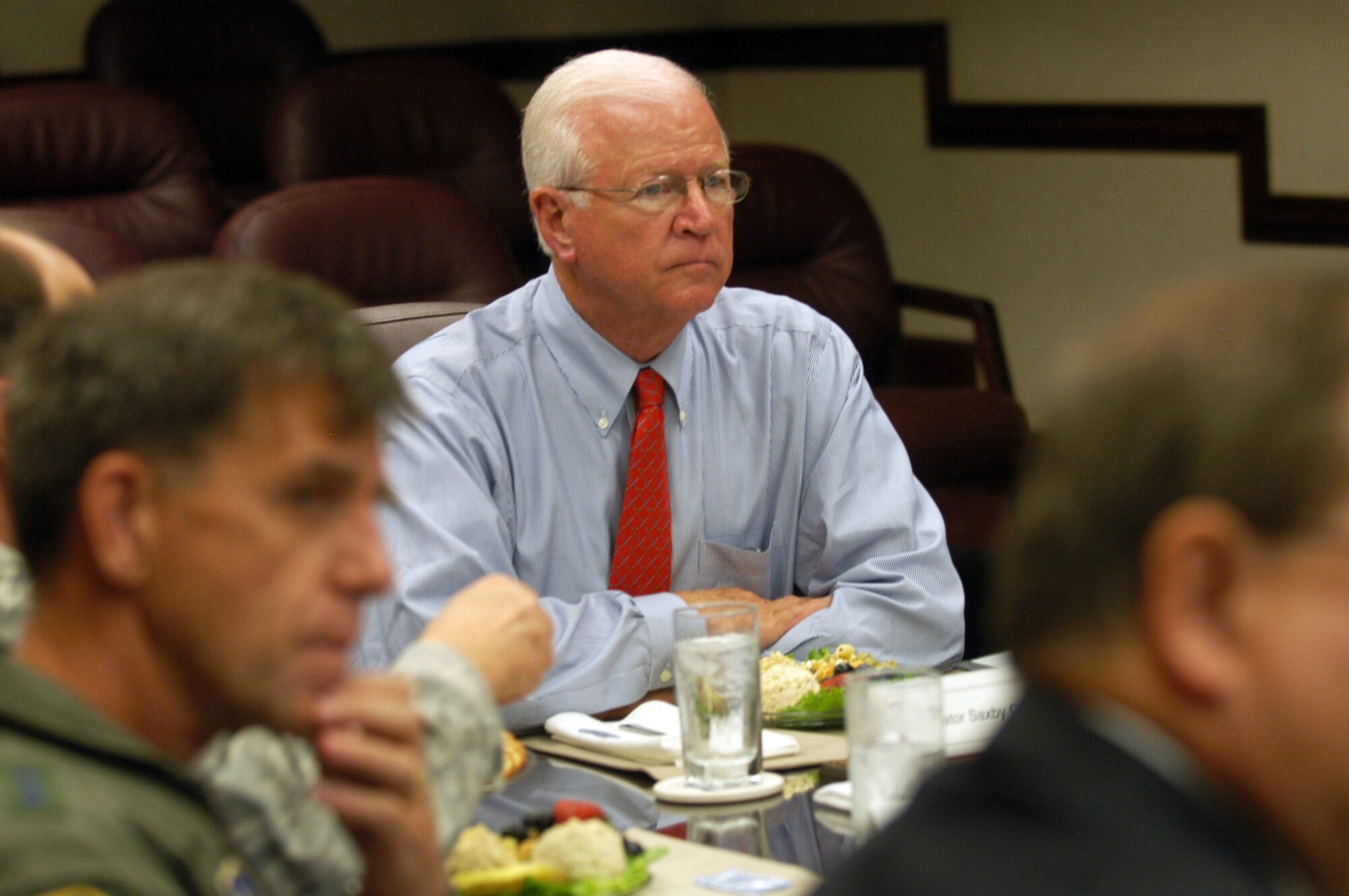 Georgia Sen. Saxby Chambliss listens to a briefing during a visit to Robins Aug. 12. The Republican senator met with senior leadership to discuss some major initiatives impacting the base and the area. (U. S. Air Force photo by Sue Sapp)