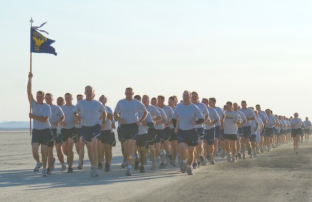 Members of the 412th Test Wing run on Roger's Dry Lakebed during the Installation Fitness Run Aug. 7. The lakebed is made up of compacted clay covering approximately 44 square miles on Edwards with runways used for aircraft emergency landings. The 2.8-mile run began and finished in front of building 1830. After leaving the taxi-way, runners were completely surrounded by desert as they watched the base disappear in the distance. There were no distinguishing landmarks on the dry lakebed; GPS devices were used to lay out the course. 
