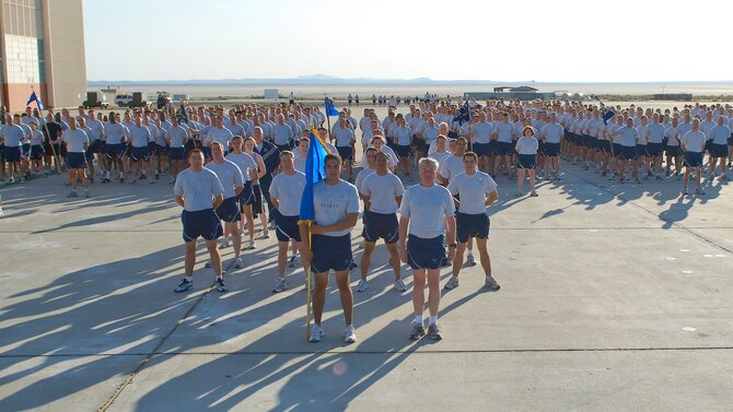 Maj. Gen. David Eichorn, Air Force Flight Test Center commander, and Team Edwards form up in front of Building 1830 Aug. 7 for a 2.8-mile run on Roger’s Dry Lakebed. The lakebed is made up of compacted clay covering approximately 44 square miles on Edwards with runways used for aircraft emergency landings. After leaving the taxi-way, runners were completely surrounded by desert as they watched the base disappear in the distance. There were no distinguishing landmarks on the dry lakebed; GPS devices were used to lay out the course. 
