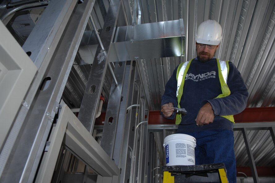MINOT AIR FORCE BASE, N.D. -- Heating ducts are installed in the new dormitories Aug. 12, by contractor Robert Debello. The new dormitories are being built to accommodate the base’s influx of new Airmen in support of Global Strike Command. The dorms will be more modern and updated to provide Minot’s Airmen with a comfortable home. (U.S. Air Force Photo by SSgt Stacy Moless)