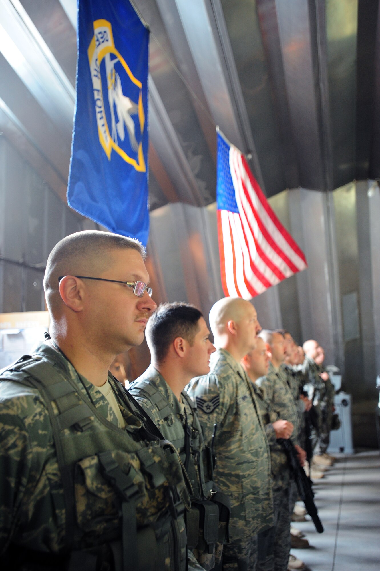 Tech. Sgt. Joe Klich, Staff Sgt. Nate Silvers, Staff Sgt. Jon Emmerich, Senior Airman Jonathon Jaeger and Staff Sgt. Michael Alvareaz, members of the 376th Expeditionary Security Forces Squadron, stand in formation at Transit Center at Manas, Kyrgyz Republic. These five members are joined by 26 of their Madison-based counterparts, from the 115th Security Forces Squadron, in providing perimeter and flight line defense at the base until their return home early next year. (Photo Courtesy)