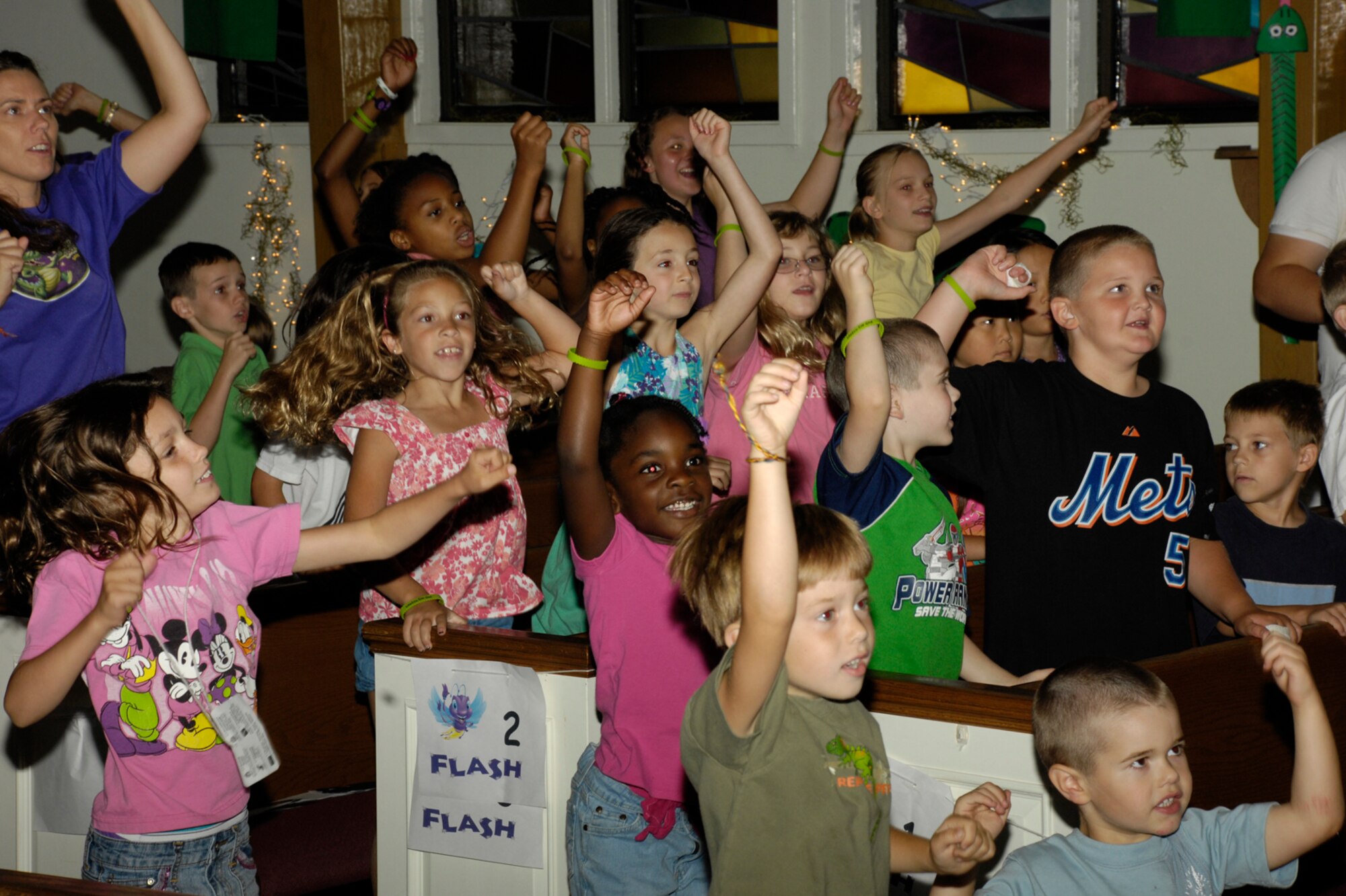 HANSCOM AIR FORCE BASE, Mass. –Participants in the Base Chapel’s Vacation Bible School join together in song during one of the opening activities. The Chapel hosted their annual Bible School from Aug. 3 to 7 for base children. (U.S. Air Force photo by Linda LaBonte Britt)