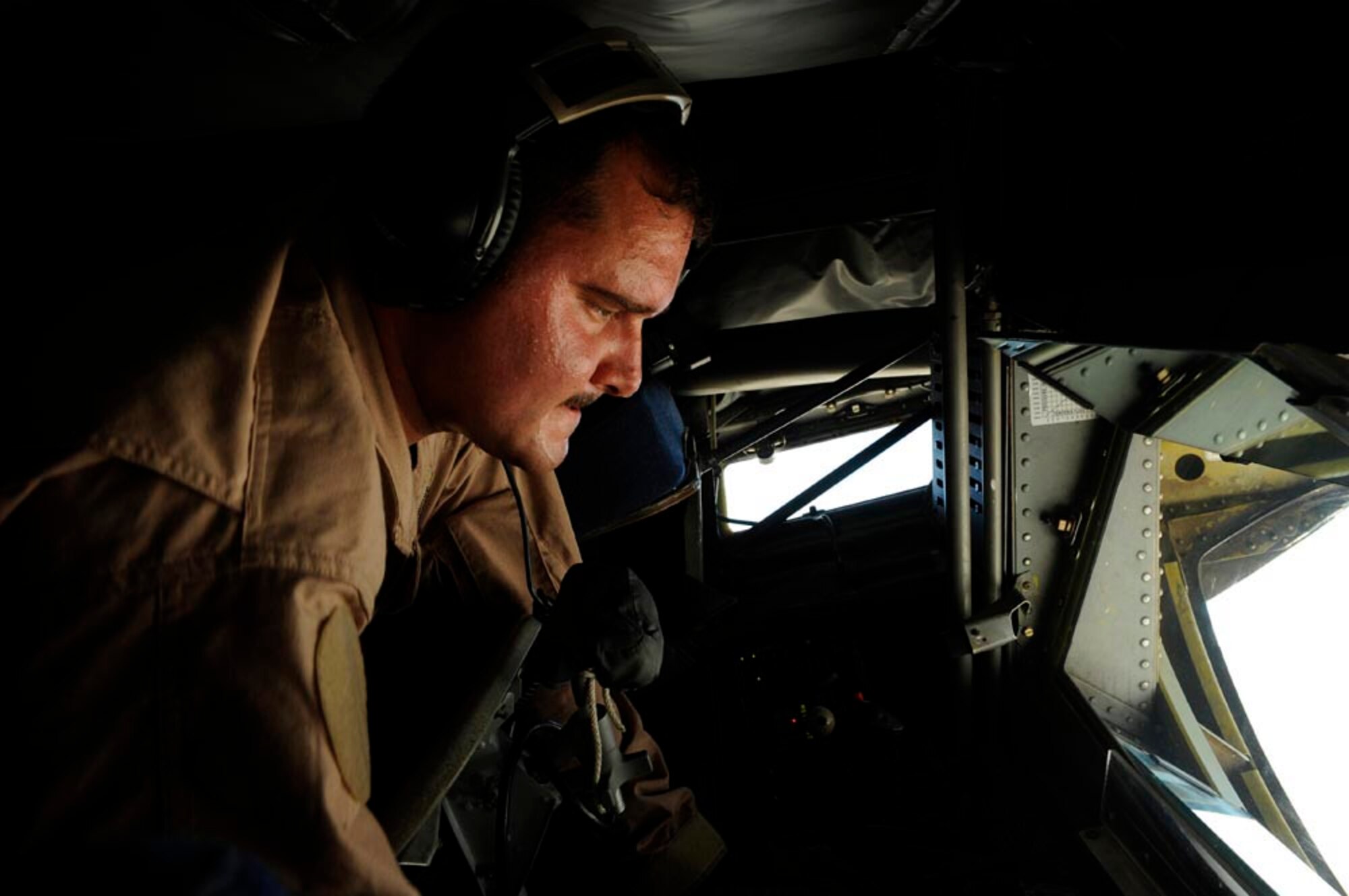 A boom operator aboard a KC-135 Stratotanker from the 379th Air Expeditionary Refueling Squadron refuels F-16CJ Fighting Falcons somewhere over Iraq, July 28, 2009. The KC-135 is one of the aircraft Air Mobility Command and the Air Force has to help the Air Force to "fly, fight and win...in air, space and cyberspace." (U.S. Air Force photo by Staff Sgt. Michael B. Keller) 
