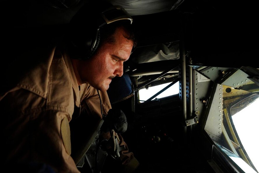 A boom operator aboard a KC-135 Stratotanker from the 379th Air Expeditionary Refueling Squadron refuels F-16CJ Fighting Falcons somewhere over Iraq, July 28, 2009. The KC-135 is one of the aircraft Air Mobility Command and the Air Force has to help the Air Force to "fly, fight and win...in air, space and cyberspace." (U.S. Air Force photo by Staff Sgt. Michael B. Keller) 
