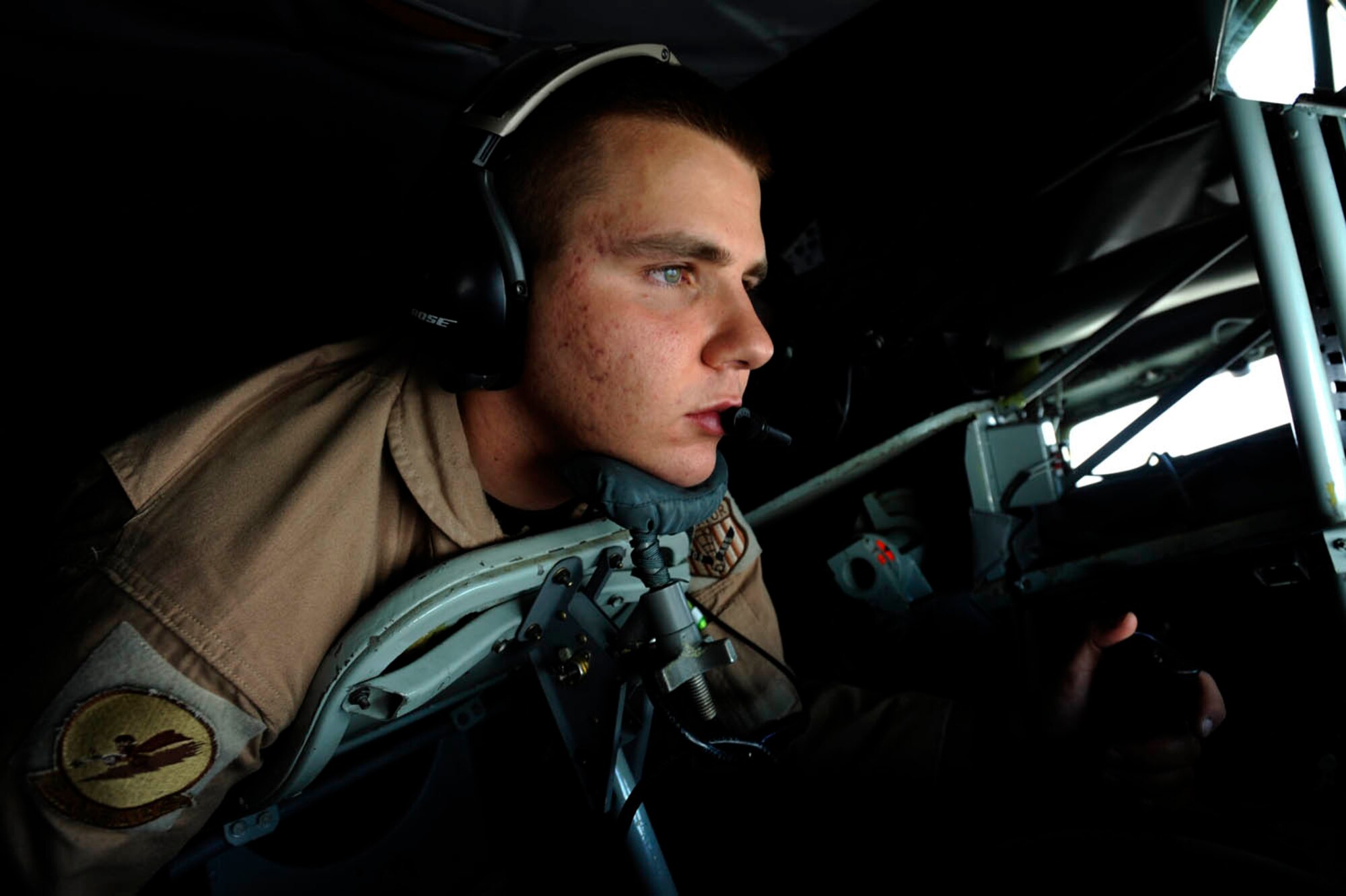 Airman 1st Class Jacob Aufderheide, a boom operator from the 379th Expeditionary Air Refueling Squadron, refuels aircraft over Afghanistan in support of Operation Enduring Freedom on a KC-135 Stratotanker, July 30, 2009.  The KC-135 is one of the aircraft Air Mobility Command and the Air Force has to help the Air Force to "fly, fight and win...in air, space and cyberspace." (U.S. Air Force Photo/Staff Sgt. Michael B. Keller)

