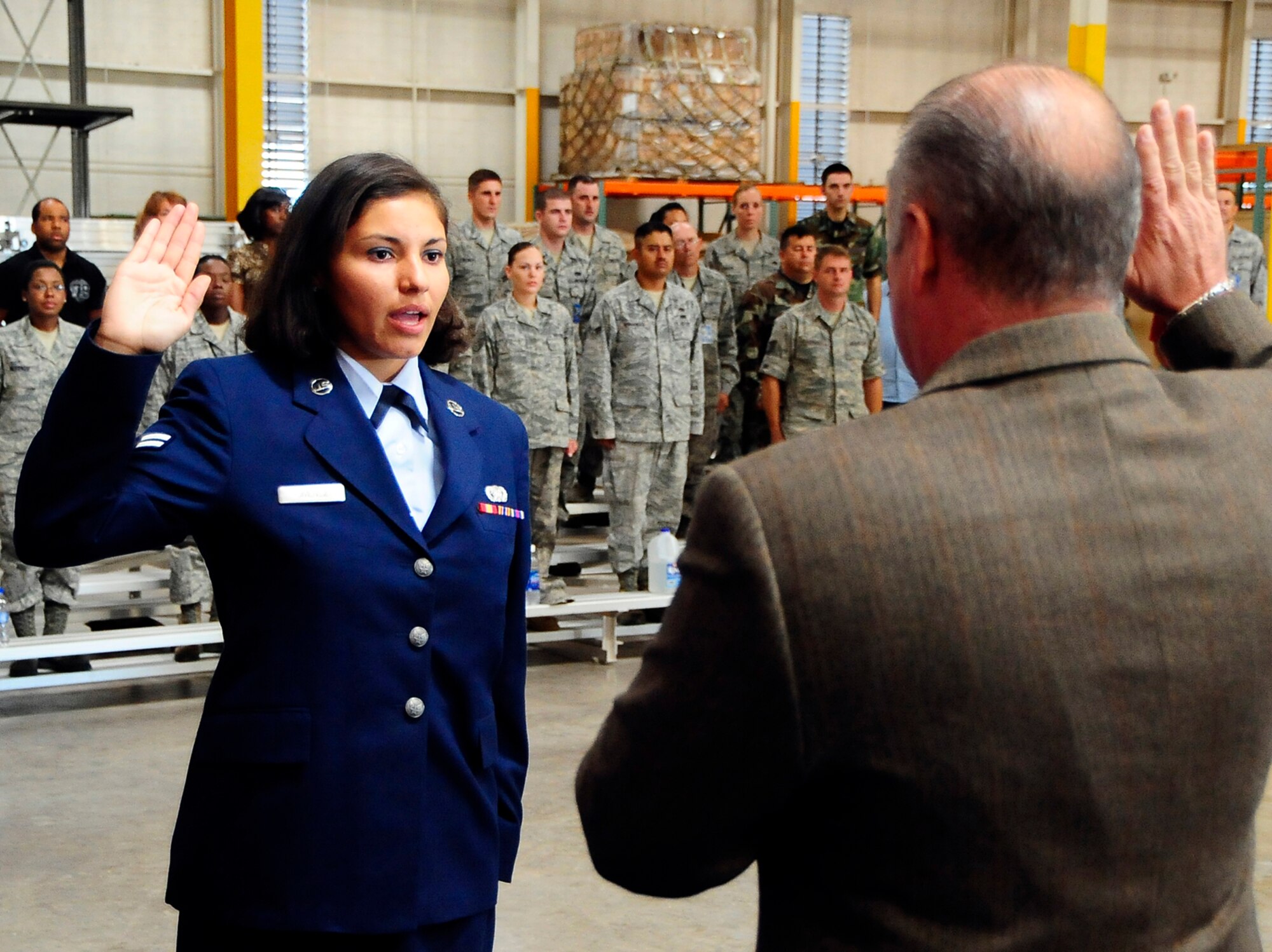 HOLLOMAN AIR FORCE BASE, N.M. -- Airman 1st Class Indira Jimenez, 49th Materiel Maintenance Group, receives the Oath of Allegiance in a naturalization ceremony at Basic Expeditionary Airfield Resouces (BEAR) Base here Aug. 7. Airman Jimenez is a native of Bogota, Columbia. (U.S. Air Force photo by Tech. Sgt. Chris Flahive)