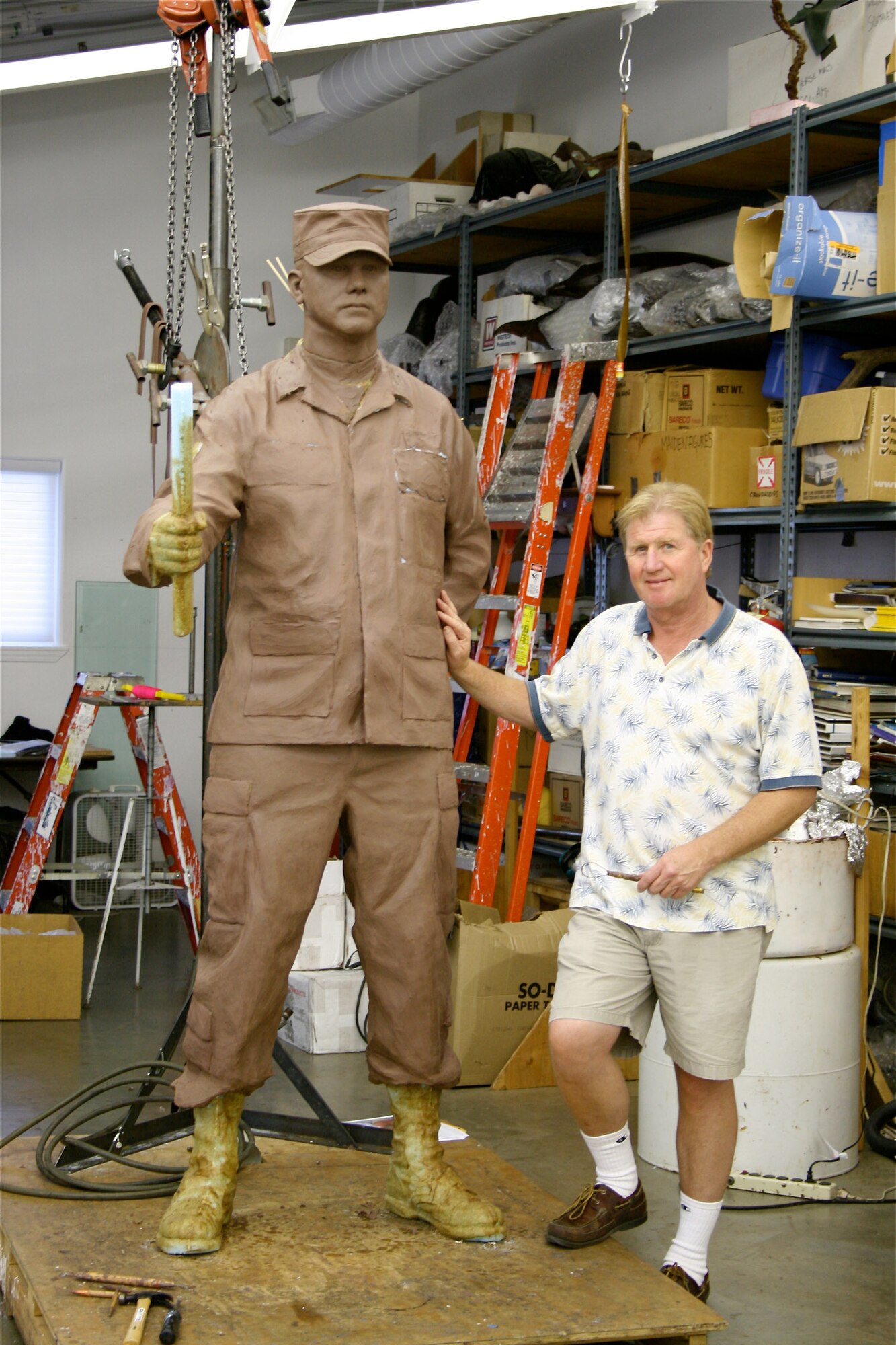 For the memorial to first sergeants the Air Force First Sergeants Academy is in the process of completing, sculptor Michael Maiden works on the yet unfinished male first sergeant statue at his studio in Oregon. For the finished memorial, this statue will be joined by a female first sergeant statue and be located at the Enlisted Heritage Hall museum at Maxwell's Gunter Annex. (Courtesy photo)