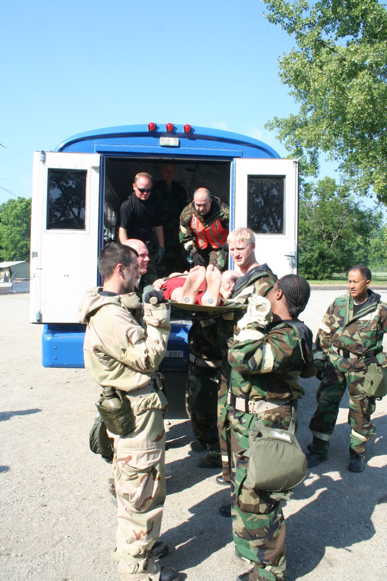 WRIGHT-PATTERSON AIR FORCE BASE, Ohio – Reservists with the 445th Aeromedical Staging Squadron load a NATO litter into an “am-bus” as part of the attack response exercise Aug. 9, 2009.   The two-day exercise was held on base at the Warfighter Training Center. (U. S. Air Force photo/Capt. Caroline Wellman)