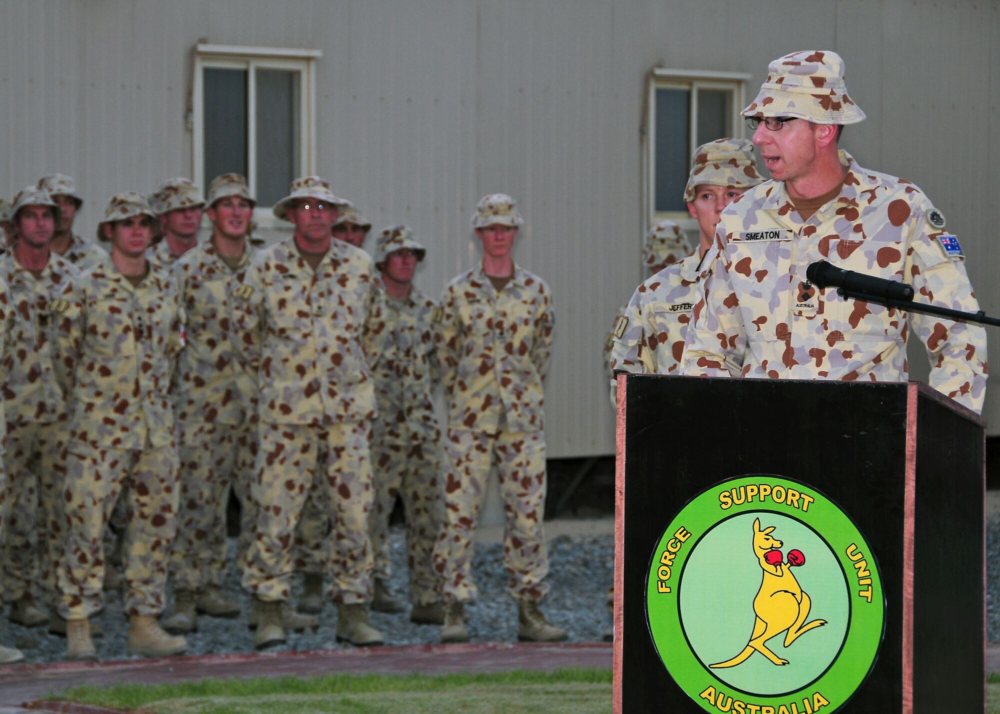 SOUTHWEST ASIA-- Lt. Col. E.J.Smeaton, Australian Defence Force Support Unit One Commander, addresses the unit for the last time during a transfer of authority ceremony at an undisclosed location in Southwest Asia August 11. Force Support Unit One is replaced by Force Support Unit Two after serving a six month tour of duty.  (U.S. Air Force photo/Tech Sgt. Tony Tolley)
