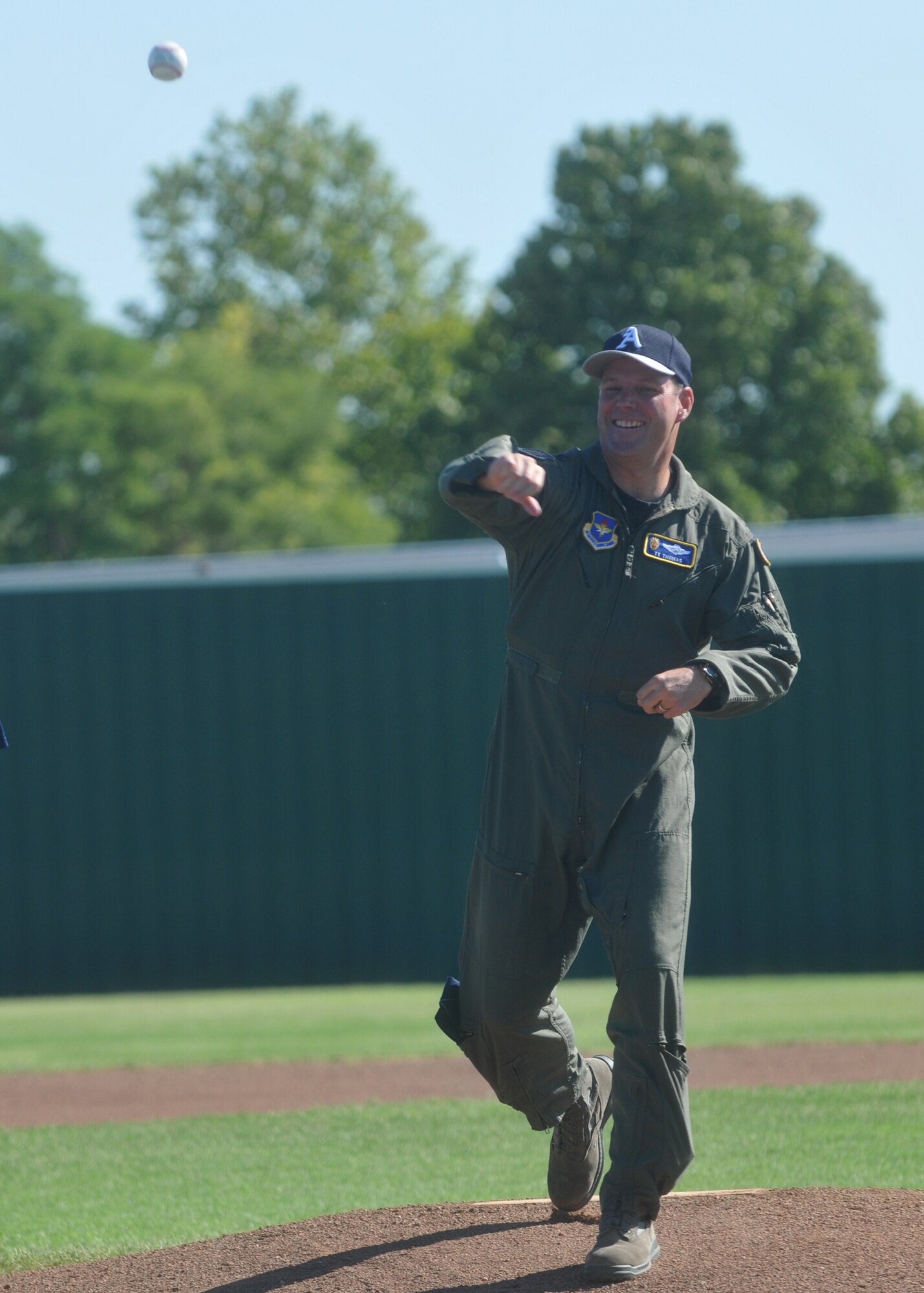 ALTUS AIR FORCE BASE, Okla. – ALTUS AIR FORCE BASE, Okla. – Col. Jon “Ty” Thomas, 97th Air Mobility Wing commander, throws the opening pitch for the Air Force Baseball Bash Aug. 8.  (U.S. Air Force photo/Senior Airman Jennifer L. Flores)