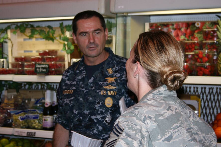 RAF ALCONBURY - Navy Fleet Master Chief Roy Maddocks, Jr. talks with Chief Master Sgt. Maria Vaughn, 501st Combat Support Wing Command Chief, about the commisary reconstruction here Aug. 11. His visit of wing facilities provided him an out look on what shape the facilities are in at the 501st Combat Support Wing. Fleet Master Chief Maddocks is the U.S. European Command's Senior Enlisted Leader.