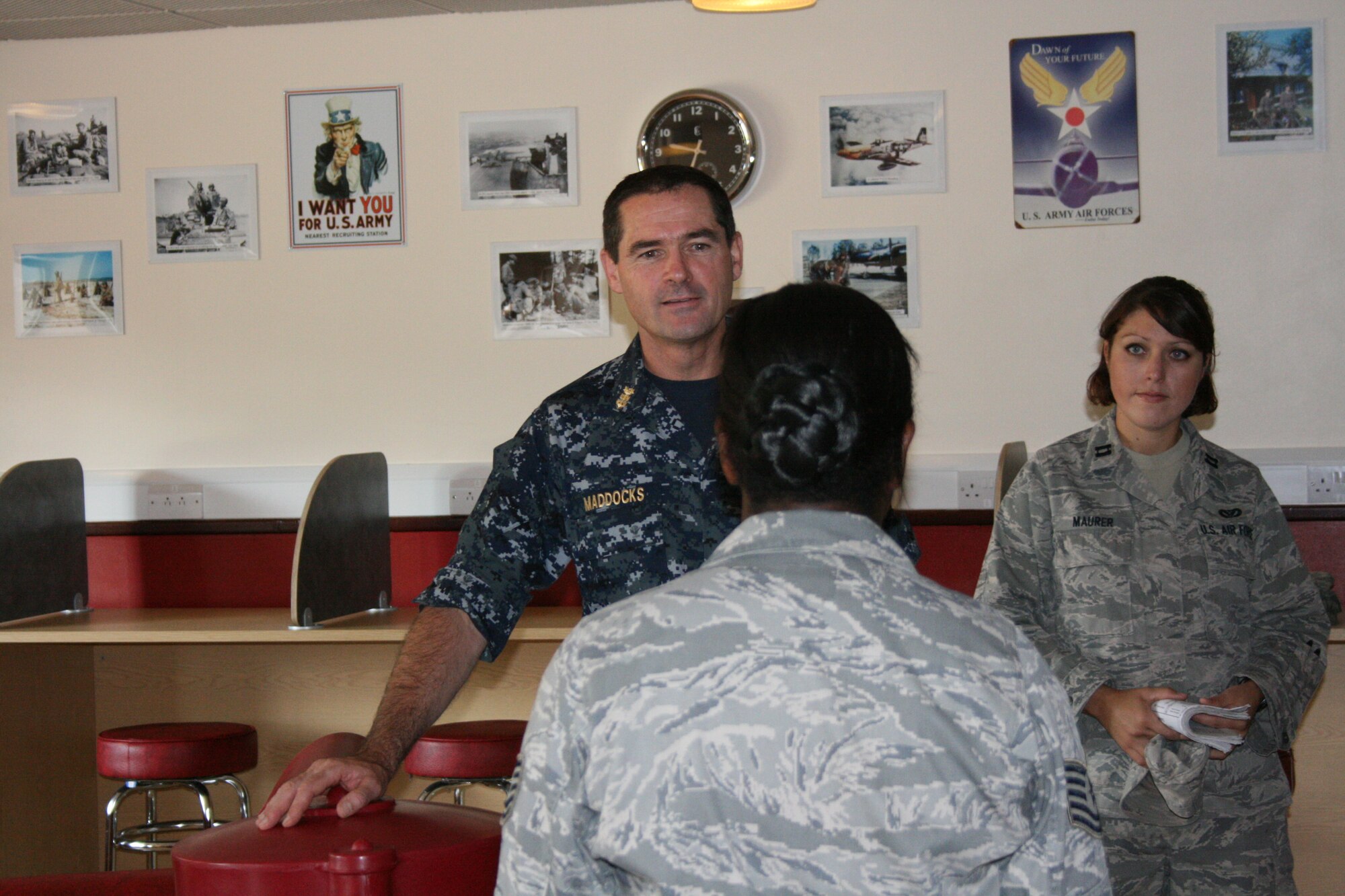RAF ALCONBURY - Navy Fleet Master Chief Roy Maddocks, Jr. talks with Air Force Tech. Sgt. Deneisha Jones about the new Heritage room built in the dorms here Aug. 11. His visit of wing facilities provided him an out look on what shape the facilities are in at the 501st Combat Support Wing. Fleet Master Chief Maddocks is the U.S. European Command's Senior Enlisted Leader.