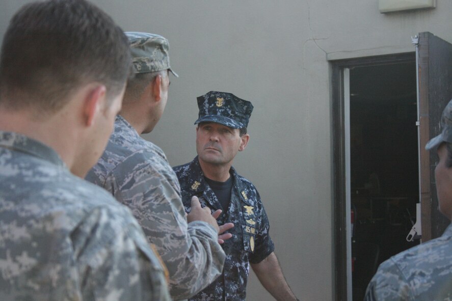 RAF ALCONBURY - Navy Fleet Master Chief Roy Maddocks, Jr. visits The Grind, a coffee shop here Aug. 11. His visit of wing facilities provided him an out look on what shape the facilities are in at the 501st Combat Support Wing. Fleet Master Chief Maddocks is the U.S. European Command's Senior Enlisted Leader.