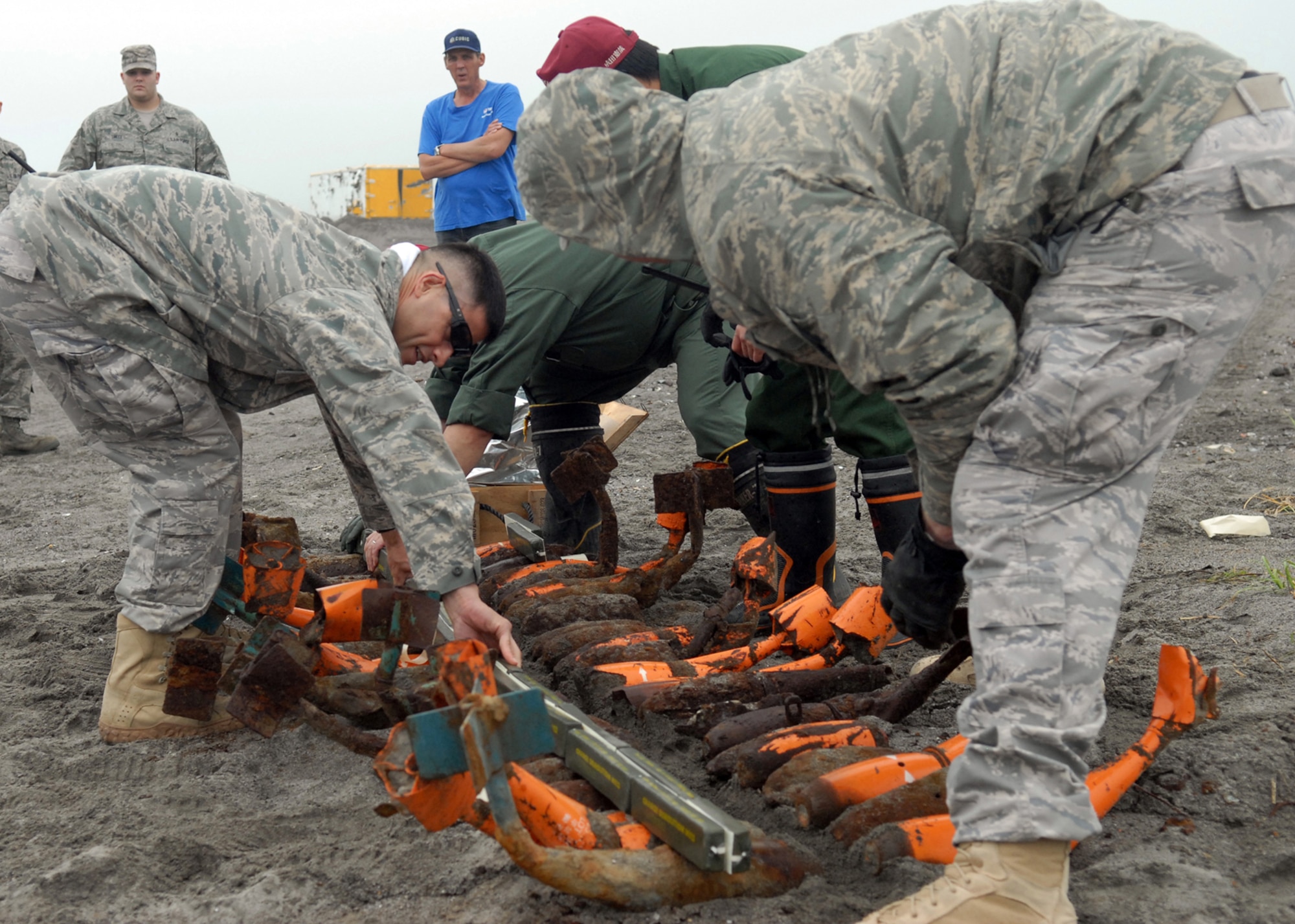 MISAWA AIR BASE, Japan – Tech. Sgts. Felipe Lucero and Rory Stark, 35th Civil Engineer Squadron explosive ordinance disposal technicians, prepare bomb dummy unit for detonation Aug. 7 at Draughon Range. EOD technicians use C4 to destroy the hazardous munitions in an effort to make them safe for salvage. (Air Force photo/Staff Sgt. Phillip Butterfield)