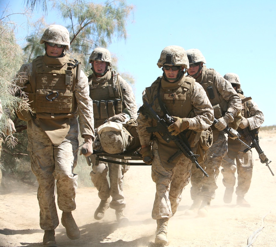 U.S. Marines carry a comrade wounded in a simulated indirect fire attack as part of their pre-deployment training on Marine Corps Air Ground Combat Center, Twentynine Palms, Calif., Aug. 8, 2009. The Marines are assigned to Headquarters Company, 7th Marine Regiment.