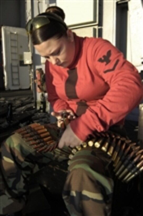 U.S. Navy Petty Officer 3rd Class Meghan Schnurr prepares .50-caliber ammunition for a live-fire exercise aboard the aircraft carrier USS Nimitz (CVN 68) in the Pacific Ocean on Aug. 5, 2009.  The Nimitz and embarked Carrier Air Wing 11 are underway on a deployment to the western Pacific.  