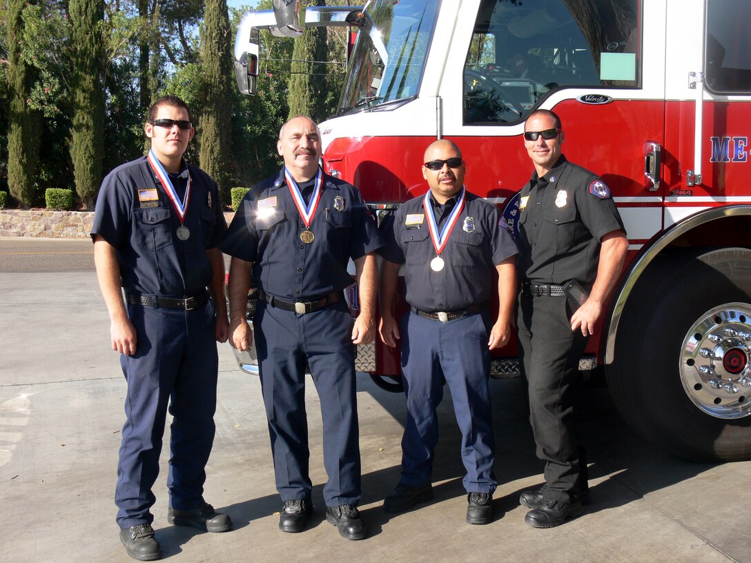Marine Corps Logistics Base Barstow firefighters (left to right) Shaun Longlee, Dell Warfield, Ruben Rodriguez and Assistant Chief Paul Purdy, proudly display medals won at the 2009 California Firefighter Olympics. The firemen competed in the annual California Firefighter Olympics, a statewide competition held in Anaheim, Calif., that promotes camaraderie and sportsmanship amongst the fire departments.