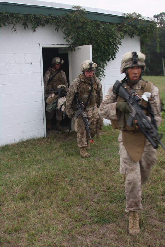 Marine with B Company, Battalion Landing Team 1st Battalio, 9th Marine Regiment, 24th Marine Expeditionary Unit, evacuate a mock casualty during a motorized raid at Camp Cooke aboard U.S. Army Base A.P. Hill, Va.  This training scenario simulated driving to a village area, clearing and securing the area, and returning to a defended position.