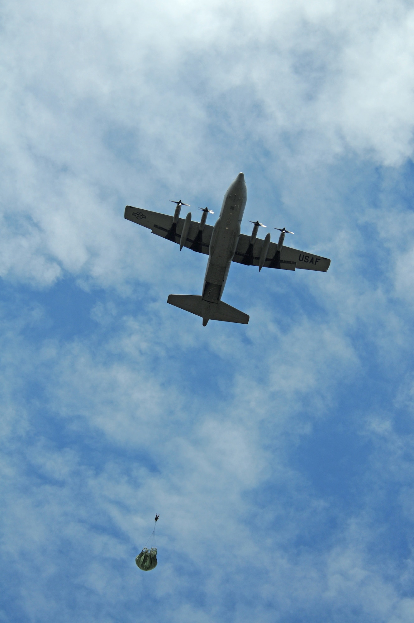 U.S. Air Force Col. Timothy Brown, 86th Contingency Response Group commander, parachutes out of a C-130 Hercules over Bunker drop zone in southwestern, Germany on Aug. 13, 2009.  U.S. soldiers and airmen performed a combined airborne jump with four other NATO countries. German, Italian, Belgium, and Dutch army attended the airborne jump during NATO Jump Week. (U.S. Air Force photo by Airman 1st Class Grovert Fuentes-Contreras)