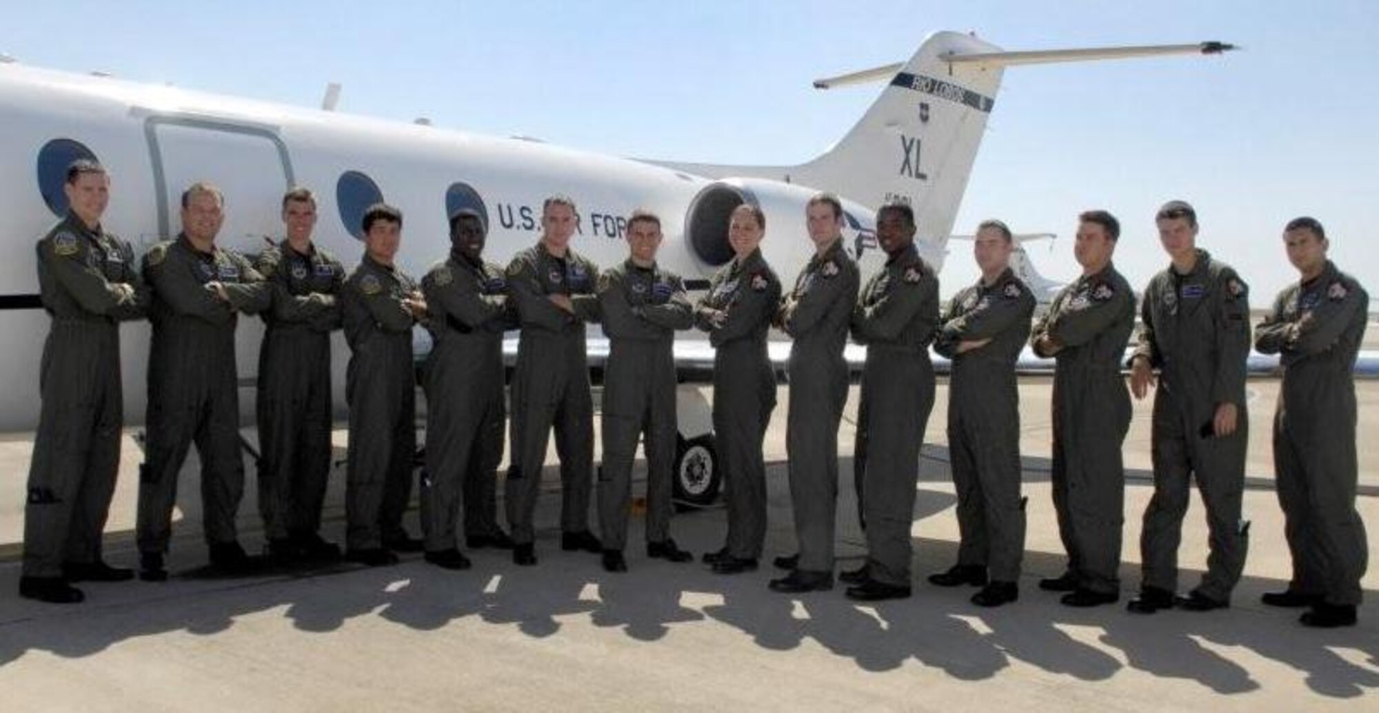 LAUGHLIN AIR FORCE BASE, Texas—Specialized Undergraduate Pilot Training class 09-13 stands with a T-1A Jayhawk training aircraft here.  The class graduates Friday, August 14. (USAF photo by Jose Mendoza) 