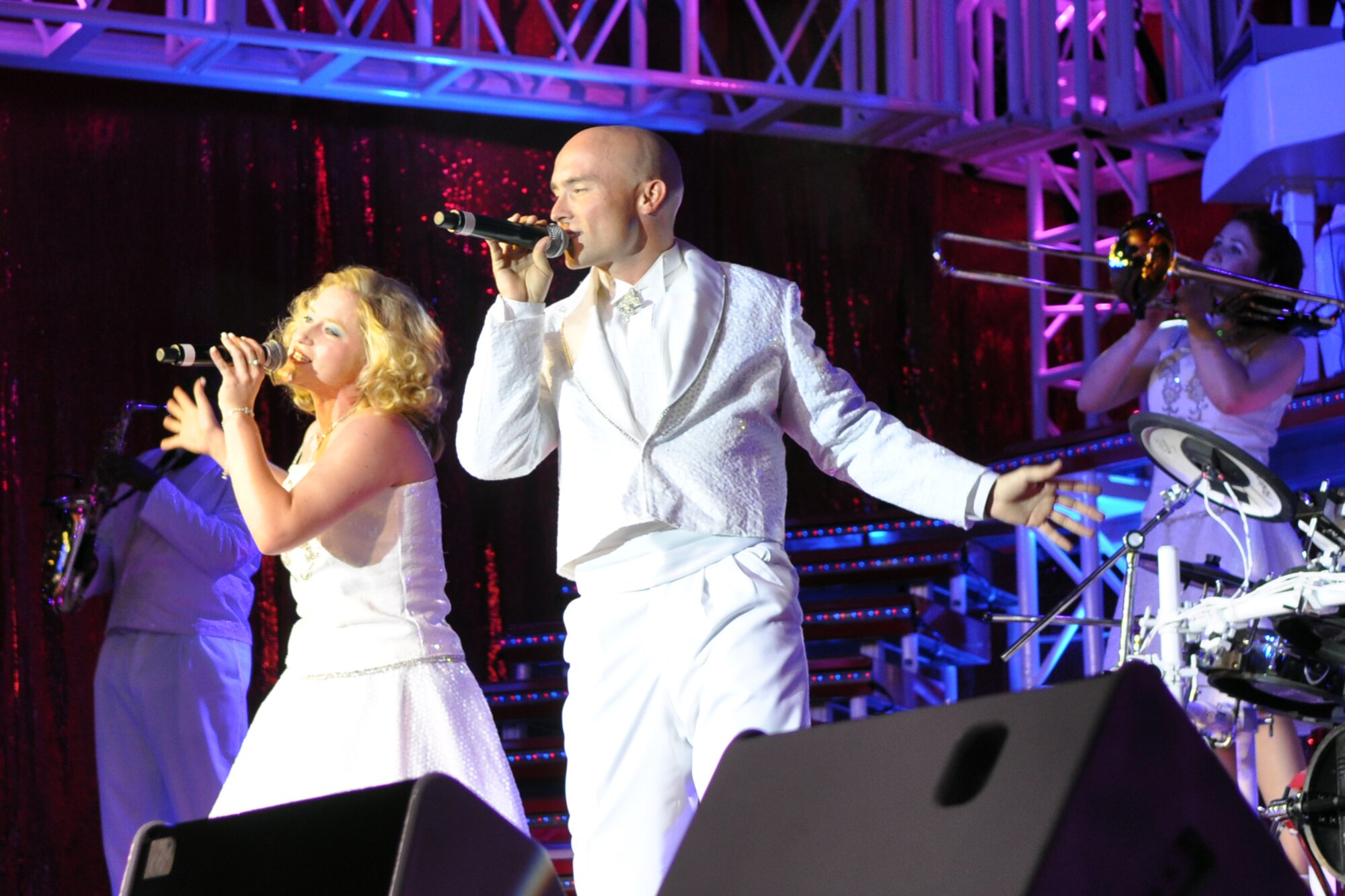 Senior Airman Jennifer Frost, services journeyman, 78th Force Support Squadron, Robins Air Force Base, GA, and Senior Airman Jeffrey Collins, emergency management apprentice, 87th Civil Engineer Squadron, McGuire Air Force Base, NJ, perform a romantic duet during a free concert at Hoban Hall on Barksdale Air Force Base, La., August 12, 2009. Tops in Blue, and their Expeditionary Entertainers, have entertained servicemembers and their families, Coalition partners and audiences around the world for 56 years. (U.S. Air Force photo/Tech. Sgt. Jeff Walston)