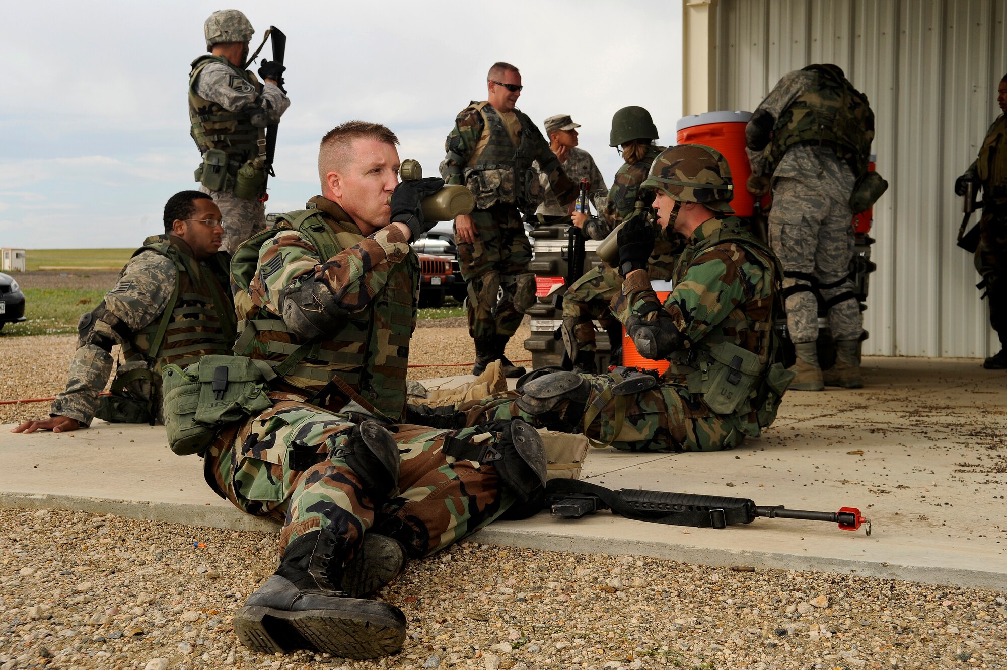 Tech. Sgt. Jeffrey Cochran, 460th Civil Engineering Squadron, hydrates after an exercise during DREST. (U.S. Air Force photo by Senior Airman Steve Czyz)
