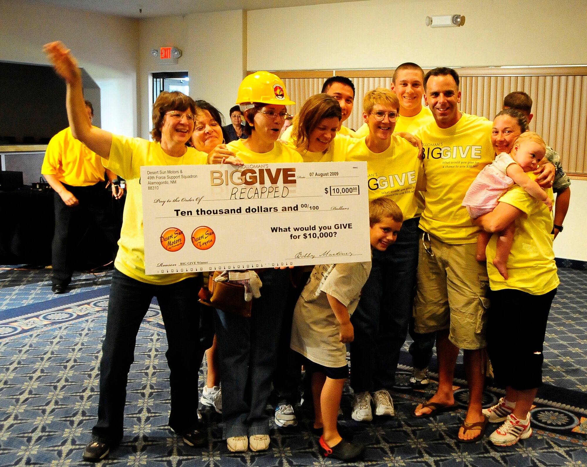 HOLLOMAN AIR FORCE BASE, N.M. -- Team RECAPPED celebrates after being announced the grand prize winner of the 2009 Big Give at the after-party here Aug. 7. RECAPPED spent three weeks working with the Cancer Awareness Prevalence Prevention and Early Detection center of Otero County, a non-profit corporation dedicated to helping the community combat the devastation of cancer. (U.S. Air Force photo by Tech. Sgt. Chris Flahive)