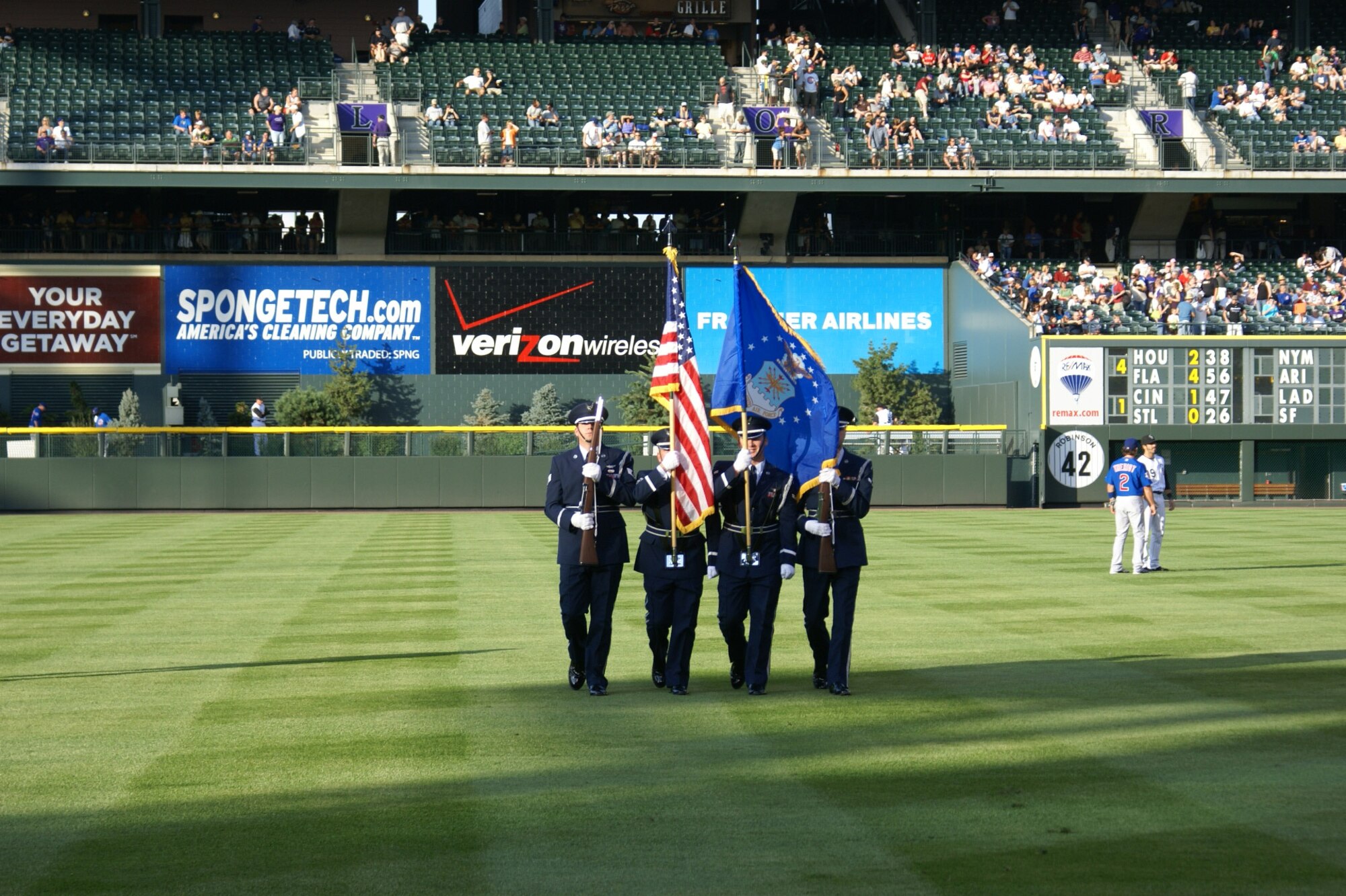 DENVER -- Presenting the colors Aug. 10 at a Rockies vs. Cubs game at Coors Field in Denver are (in no particular order) Tech. Sgt. Edward Wise, Staff Sgt. Joshua Petersen and Airmen 1st Class Kevin Scott and Samuel Wenrich, members of the Mile High Honor Guard at Buckley Air Force Base, Colo. The Mile High Honor Guard is composed of volunteers from many different career fields across Buckley. (U.S. Air Force photo)