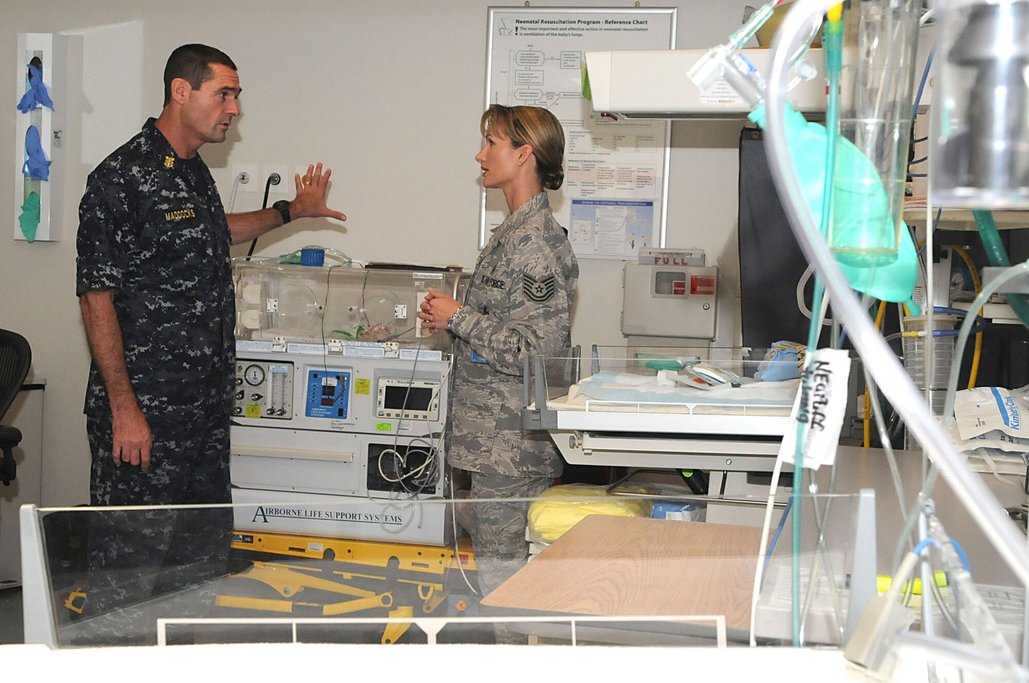 Tech. Sgt. Amber Crowe, 48th Inpatient Squadron Labor and Delivery NCO in charge, explains the ward’s processes and what is offered to newborn children and their families to Fleet Master Chief Petty Officer Roy M. Maddocks Jr., U.S. European Command Senior Enlisted Leader, on August 13, 2009, at RAF Lakenheath, England. Master Chief Maddocks stopped at Lakenheath as part of a tour to view quality-of-life initiatives at various bases throughout the United Kingdom. (U.S. Air Force photo by Senior Airman Brian J. Ellis)