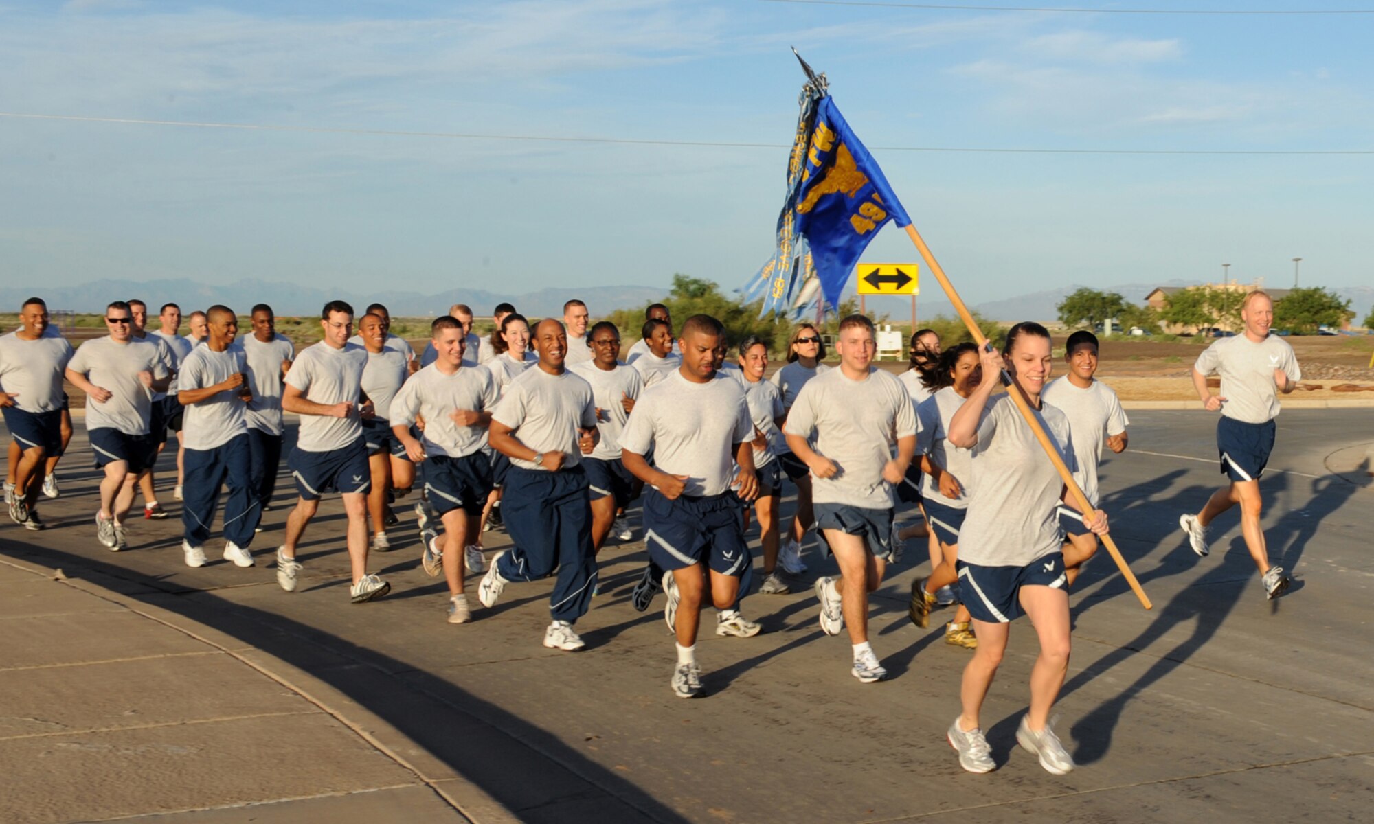 HOLLOMAN AIR FORCE BASE, N.M -- Master Sgt. April Owen, 49th Force Support Squadron first sergeant, leads her squadron during a run here, Aug. 7. The run was the first event of the Mission Support Group X-treme Challenge, a day of sports and morale buildings activities. Sergeant Owen is a native of Montgomery, Ala. (U.S. Air Force photo/Senior Airman Tiffany Trojca) 