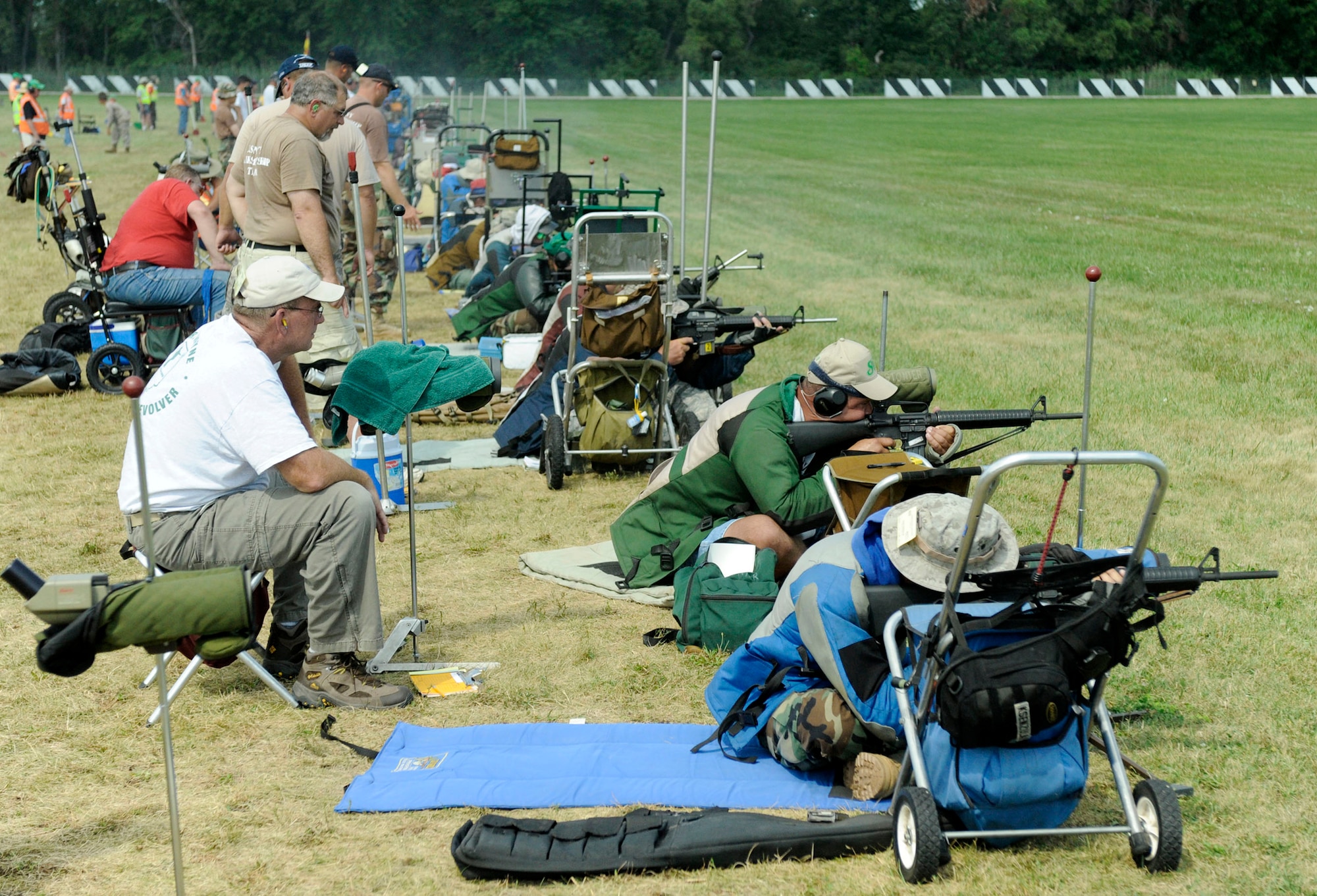 Competitors fire from the prone position during the 600-meter portion of the high power rifle competition of the National Rifle and Pistol Championships Aug. 11 at Camp Perry, Ohio. The championships are sponsored by the National Rifle Association and draw several thousand marksmen from around the United States, including teams from the Army, Air Force, Navy and Marines. (U.S. Air Force photo/Staff Sgt. Matthew Bates)