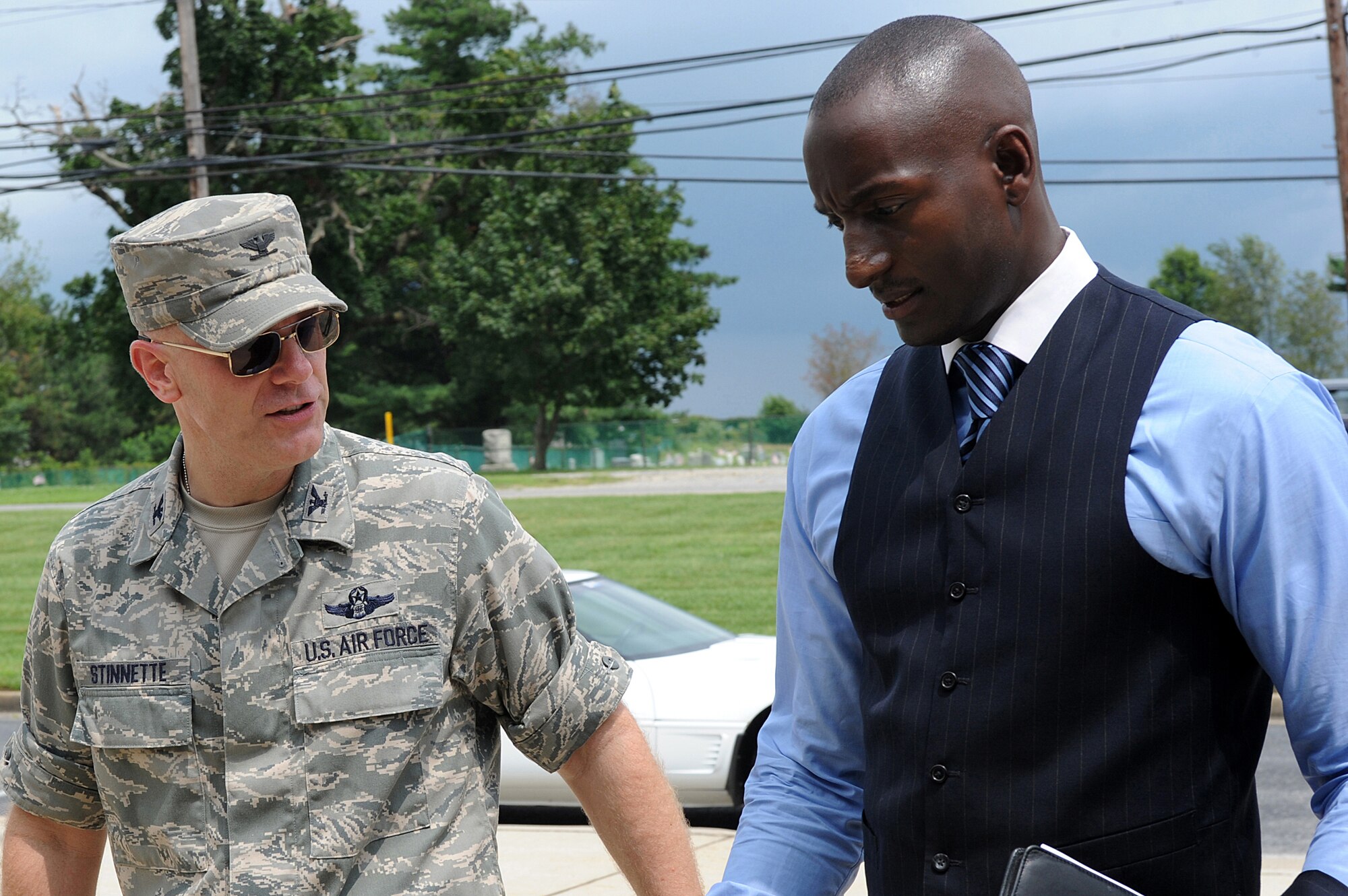 Col. Tip Stinnette, U.S. Air Force Expeditionary Center vice commander, greets Dr. Randal Pinkett before he provides 45 minutes of motivational remarks to the crowd assembled in Grace Peterson Hall Aug. 12 at the U.S. Air Force Expeditionary Center on the Fort Dix section of Joint Base McGuire-Dix-Lakehurst, N.J.  Dr. Pinkett, an entrepreneur, author, Rhodes scholar and winner of the Season 4 reality show, The Apprentice, was the third in a series of professional development speakers helping the Center celebrate its 15th Anniversary. (U.S. Air Force Photo/Staff Sgt. Nathan G. Bevier) 