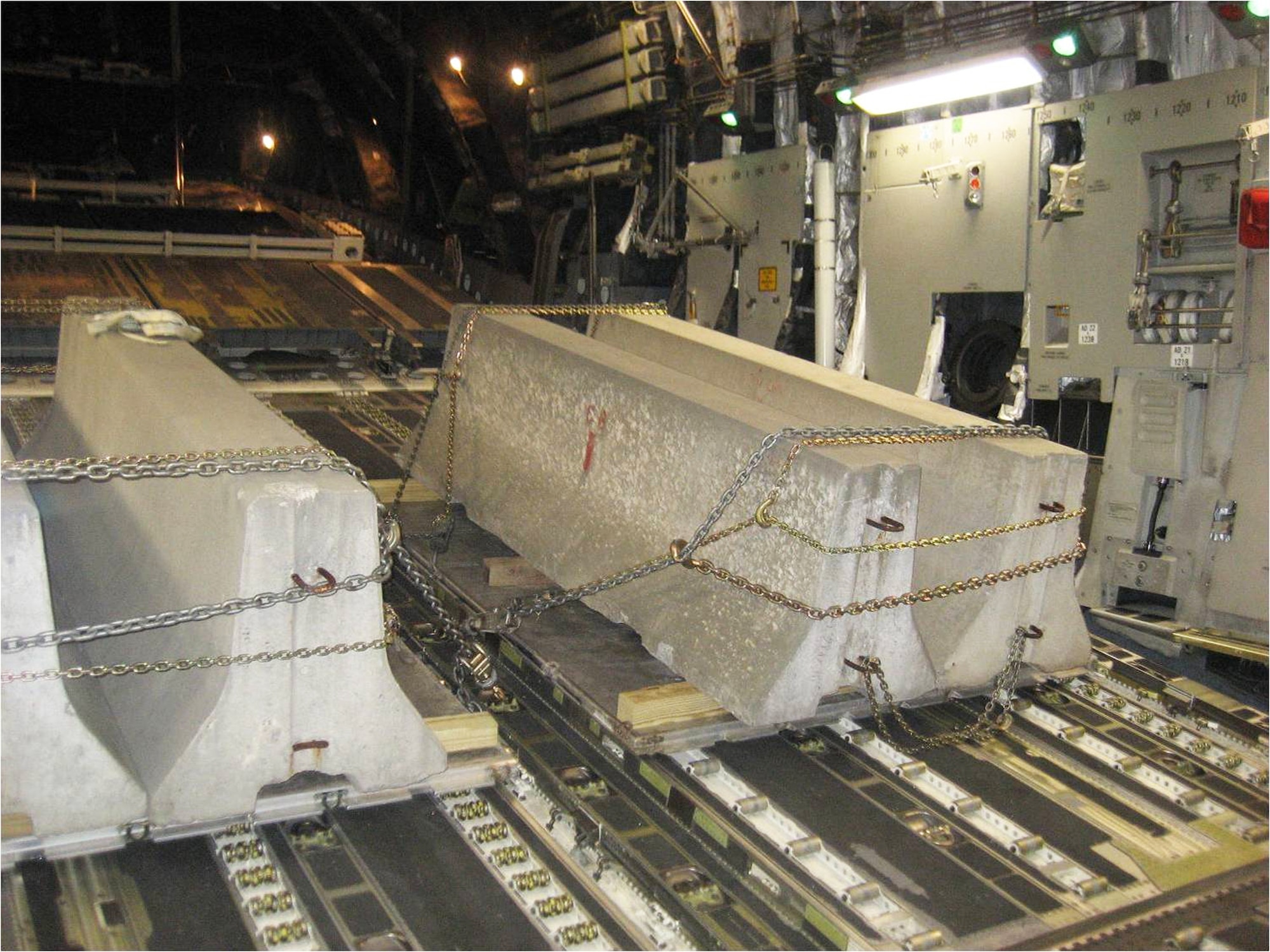 Concrete barriers are loaded onto a C-17 Globemaster to test a fuel leak repair conducted here. The test involved members of the 402nd Maintenance Wing, the 78th Civil Engineer Group and the 78th Logistics Readiness Squadron. Courtesy photo