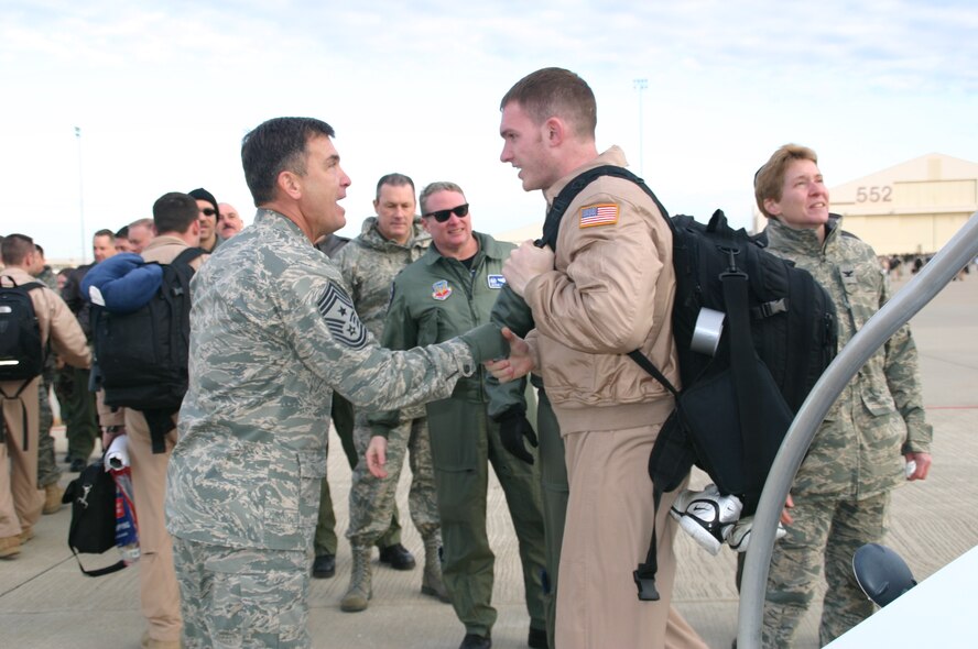 Chief Master Sgt. James Foltz welcomes one of his Airmen home after a deployment. Greeting crews as they return is one of Chief Foltz’s most cherished experiences as the former command chief of the 552 ACW. Photo courtesy of 1st Lt. Kinder Blacke.