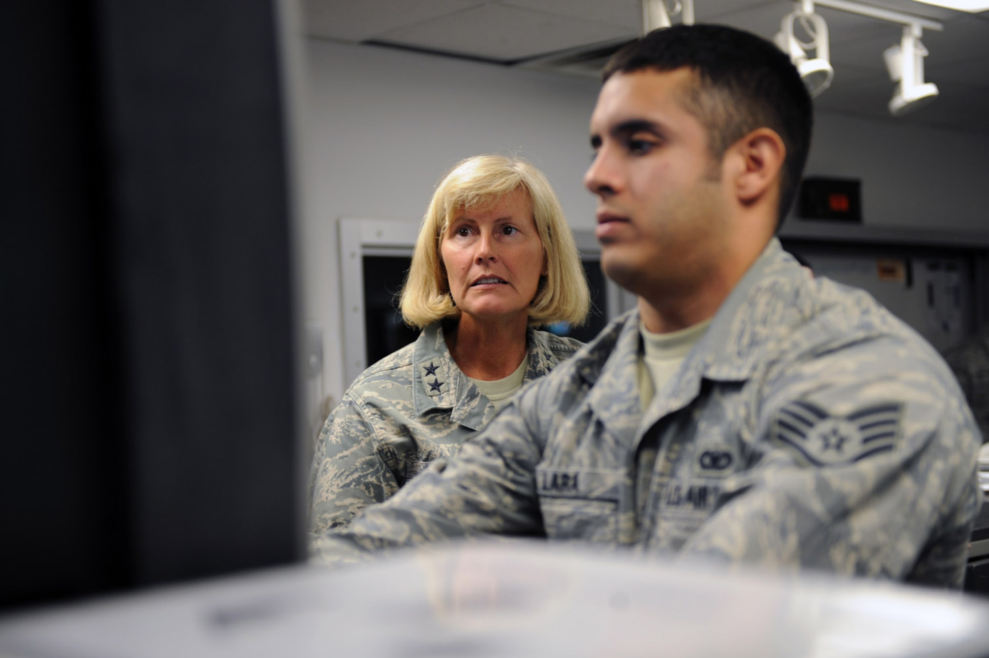 WHITEMAN AIR FORCE BASE, Mo. - Staff Sgt. Joseph Lara, 509th Security Forces Squadron, gives a briefing on Central Security Control, to Maj. Gen. Mary Kay Hertog, Director of Security Forces, Headquarters, USAF. (U.S. Air Force photo/Senior Airman Jason Huddleston)