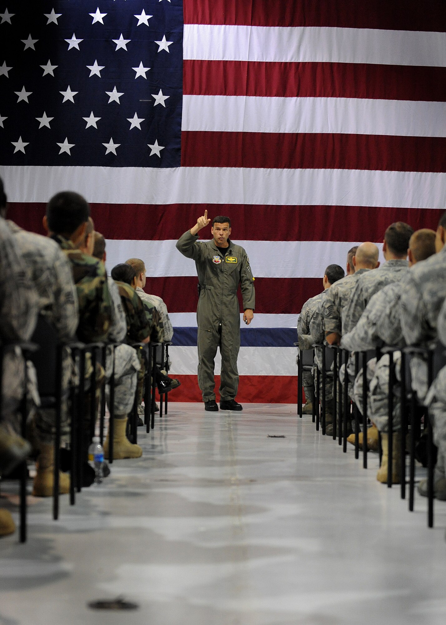 LANGLEY AIR FORCE BASE, Va. -- Col. Matthew H. Molloy, 1st Fighter Wing commander,  speaks to Airmen during a commander’s call here Aug. 12.  Colonel Molloy spoke with Airmen about the wing’s mission and vision, his expectations and personal values, as well as upcoming wing events.  (U.S. Air Force photo/Airman Rebecca Montez)