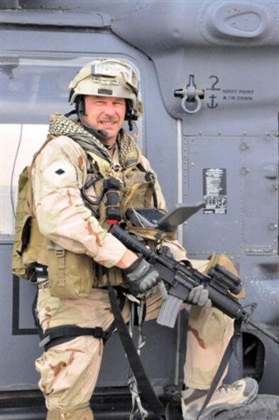 Master Sergeant Robert W. Bean, outfitted with more than 80 pounds of combat, communications and medical gear, prepares to embark on a mission in southern Afghanistan. His equipment includes a wearable computer and other technology developed by the Air Force Research Laboratory’s 711th Human Effectiveness Directorate—designed to reduce weight and increase U. S. warfighters’ efficiency in the field—which MSgt. Bean and fellow pararescue jumpers field-evaluated for application to their rescue-and-recovery mission. (Air Force photo)