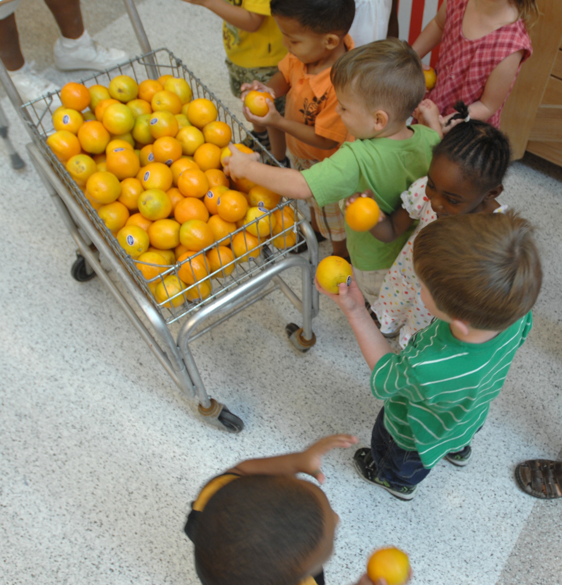 WHITEMAN AIR FORCE BASE, Mo. - The Whiteman Commissary played host to the Child Development Center’s preschool class four and Spongebob Squarepants, Aug. 5. While at the Commissary the children and Sharon Greene, produce manager, played ‘name that fruit.’ Alyne Frampton, a commissary employee, also assisted Ms. Greene and the children through the coolers and stock room. Spongebob was on hand for photos with Karen Howard and Janelle Bratton, CDC teachers and the children. C & C Produce of Kansas City, Mo donated oranges to the children as parting gifts. (U.S. Air Force photo/Senior Airman Kenny Holston)