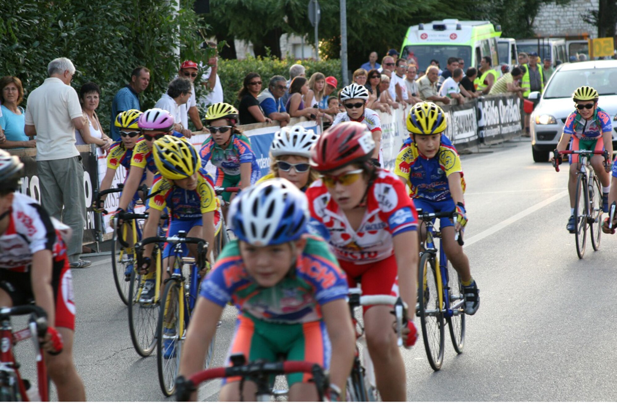 (From left to right in line wearing blue and yellow) Gregory, Analisa and Gabriel Nicodemus, children of Bryant and Renza Nicodemus, 31st Civil Engineer Squadron, line up for the start of the Notturna dell 'Assunta Trofeo B.C.C. Pordenonese race Aug. 7 in Vigonovo, Italy. The event was a scratch style race, which is a high paced race with a sprint finish. The children are members of the Societa Ciclistica Fontanafredda youth bicycle team. Gregory placed 15th in the G-5 (10-year-old) category and Gabriel placed 17th, while Analisa placed third in the girls' division. (U.S. Air Force photo/Master Sgt. Levi Sandoval)