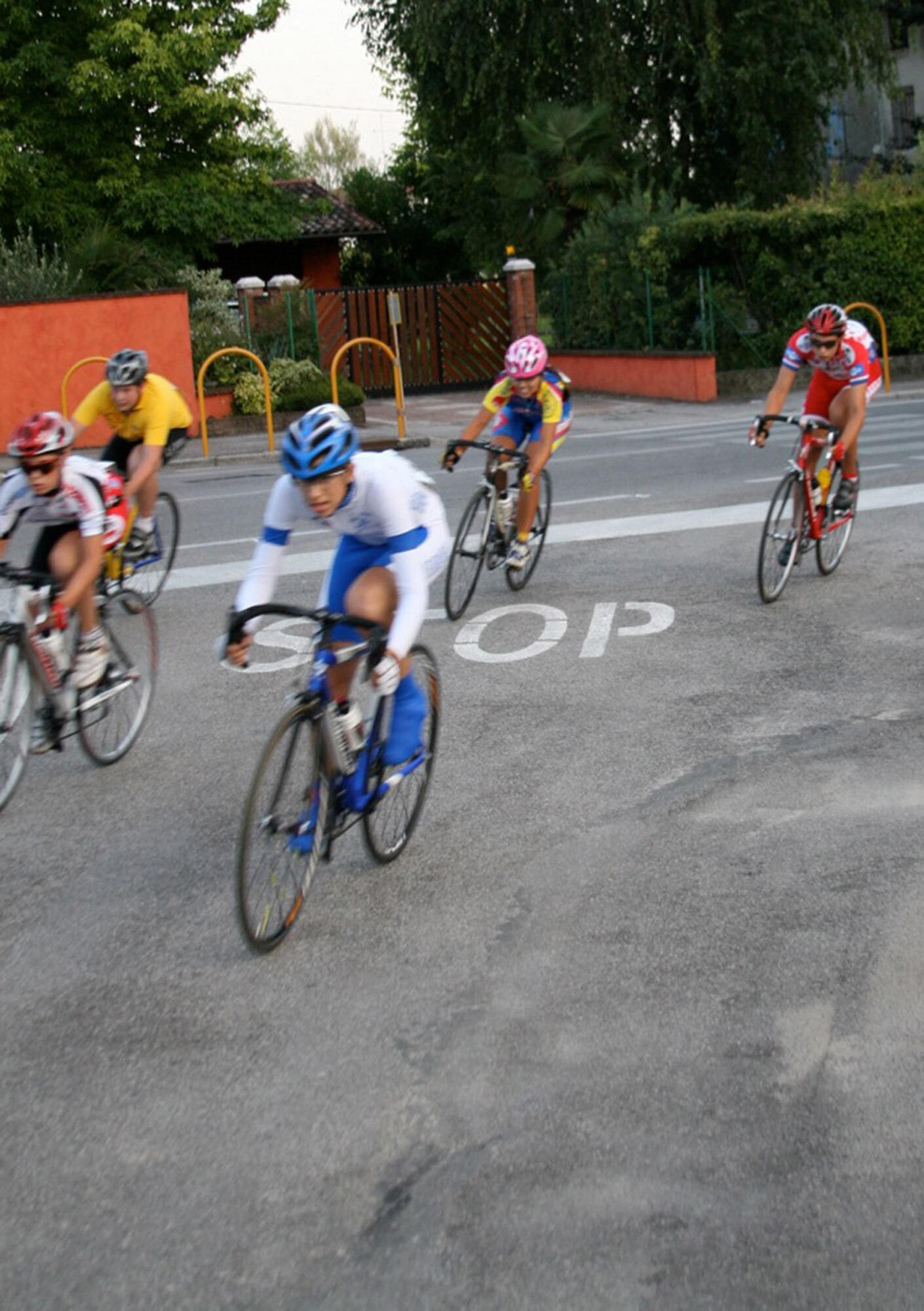 Erin Sandoval (second from right), 15-year-old daughter of Master Sgt. Levi and Brenda Sandoval, 31st Operations Support Squadron, completes the second lap of the Notturna dell 'Assunta Trofeo B.C.C. Pordenonese race Aug. 7 in Vigonovo, Italy. The event was a scratch style race, which is a high paced race with a sprint finish. Erin is a member of the Societa Ciclistica Fontanafredda and Allievi Donna youth bicycle teams. She was the only female to compete in her category. (U.S. Air Force photo/Master Sgt. Levi Sandoval)