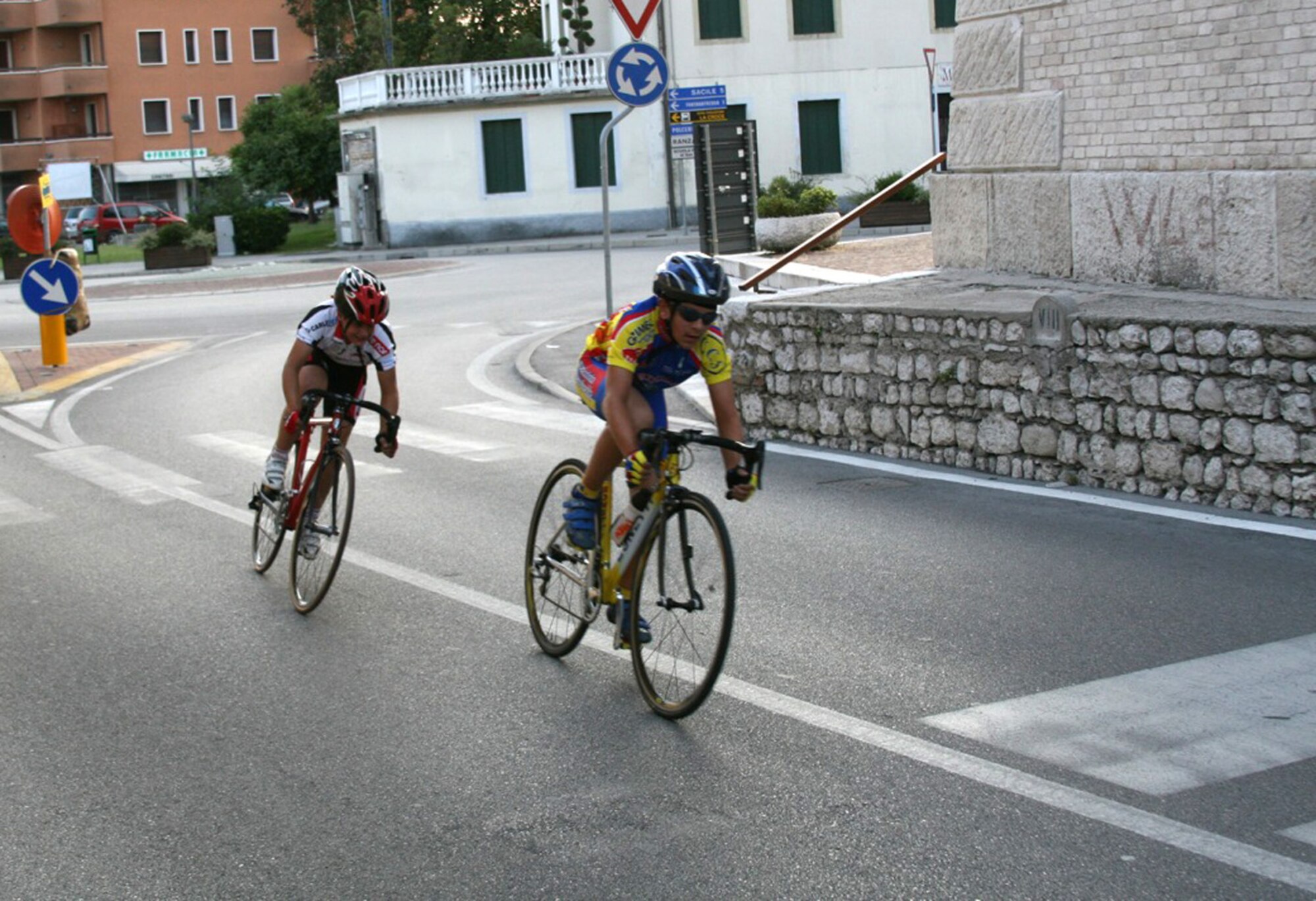 Tyler Tangen, son of Master Sgt. Richard Tangen, 31st Medical Support Squadron, pedals through the sixth and final lap of the Notturna dell 'Assunta Trofeo B.C.C. Pordenonese race Aug. 7 in Vigonovo, Italy. The event was a scratch style race, which is a high paced race with a sprint finish. Tyler, a member of the Societa Ciclistica Fontanafredda youth bicycle team, took second place in the G-6 (11-year-old) category. (U.S. Air Force photo/Master Sgt. Levi Sandoval)