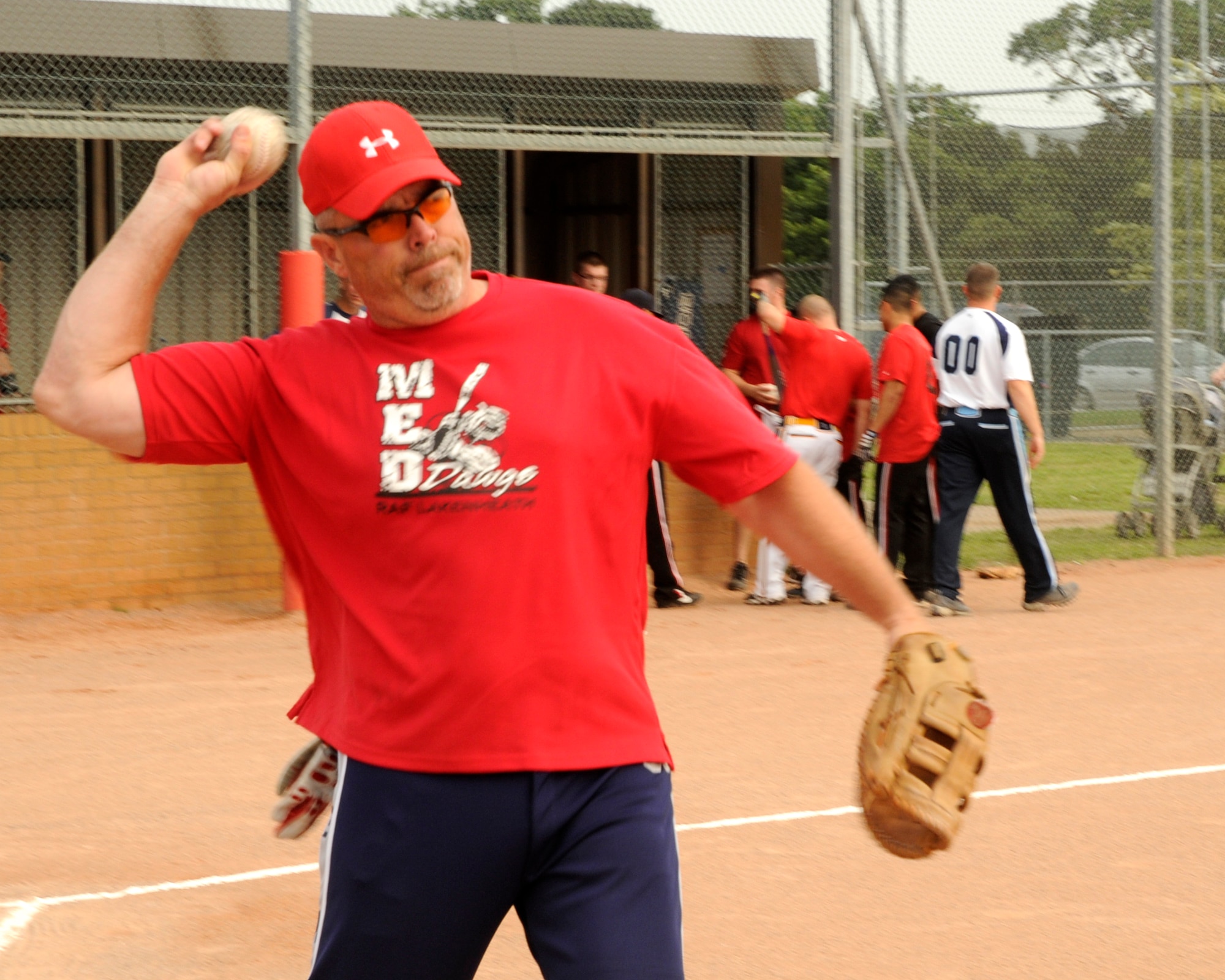 Cameron Duggan of the 48th Medical Group’s Med Dawgs warms up with a few pitches before the intramural softball championship game against the 48th Munitions Squadron’s Arms Shop on August 6, 2009, at RAF Lakenheath, England. Although the Med Dawgs lost the first of two games during the championship, they still took home the victory, winning 14 to 11 in the last game. (U.S. Air Force photo/Airman 1st Class Eboni Knox)