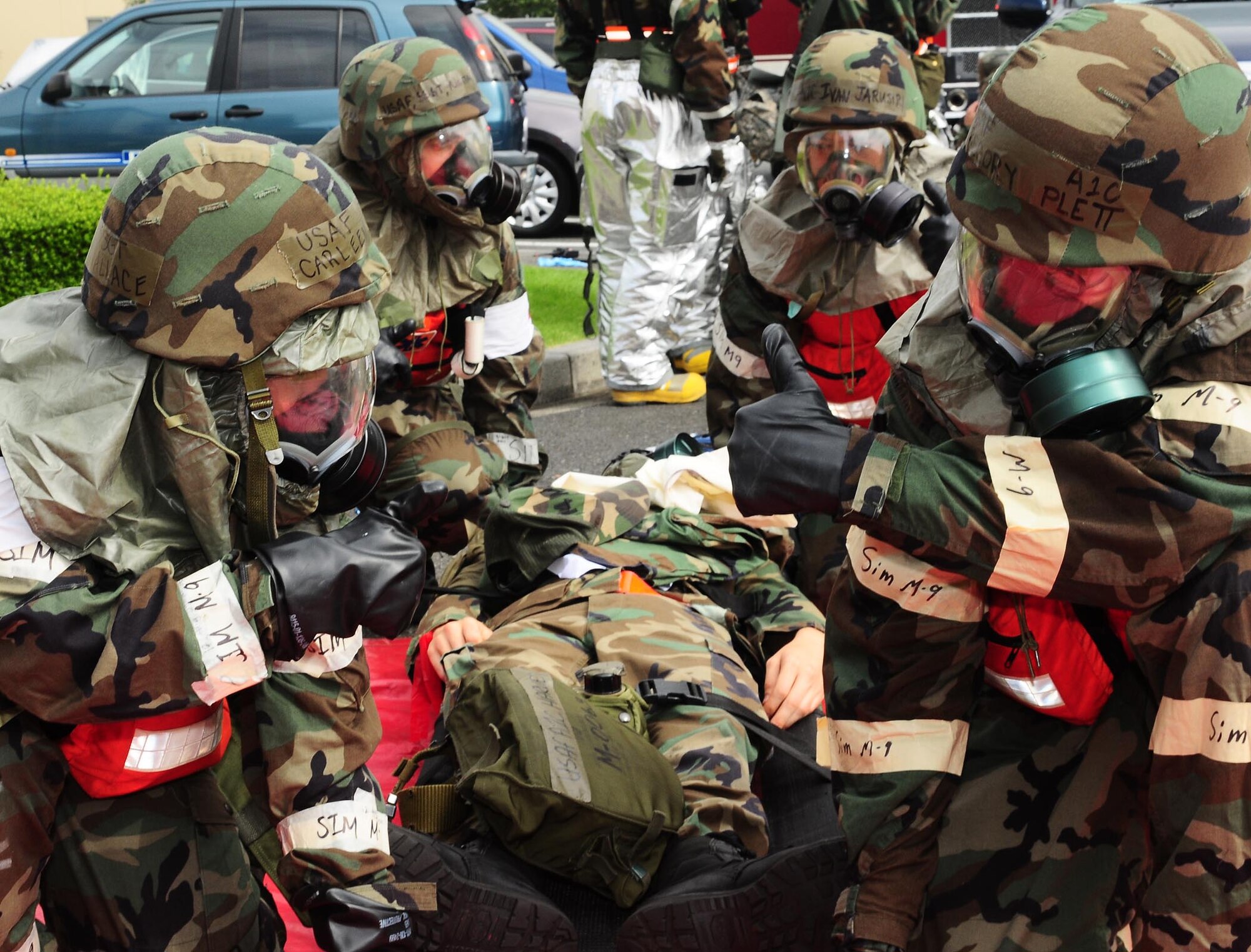 YOKOTA AIR BASE, Japan -- Base fire and medical personnel prepare a patient for transport following a simulated mortar attack, Aug 13, during Phase II Exercise Beverly Morning 09-06. (U.S. Air Force photo/Airman First Class Devin Doskey)