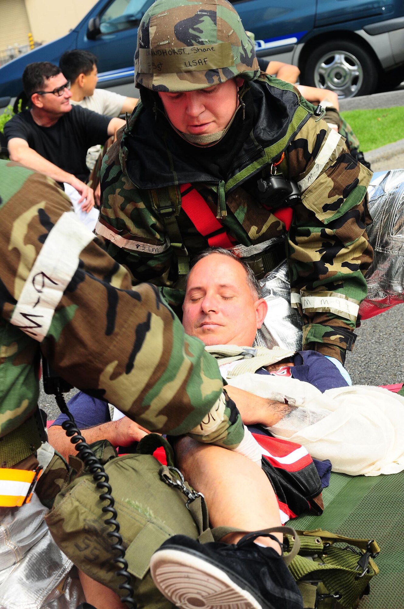 YOKOTA AIR BASE, Japan -- SSgt Sgt. Shane Brandhorst, 374th Civil Engineer Squadron, prepares a patient for transport following a simulated mortar attack, Aug 13, during Phase II Exercise Beverly Morning 09-06. (U.S. Air Force photo/Airman First Class Devin Doskey)