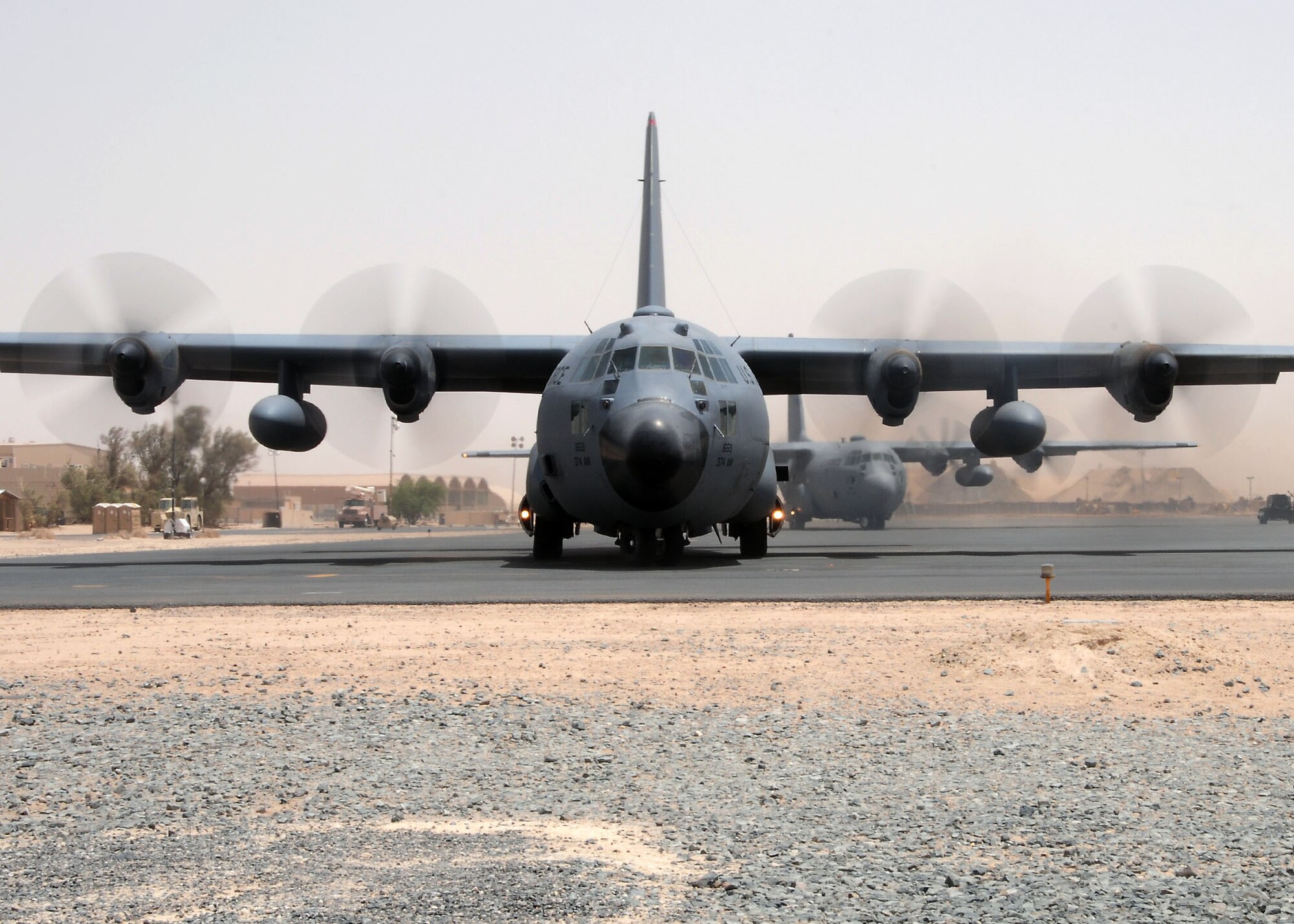 SOUTHWEST ASIA -- A 737th Expeditionary Airlift Squadron C-130 Hercules taxis out on the parking ramp prior to mission departure at an undisclosed location in Southwest Asia August 12.  The aircraft are deployed from the 374th Airlift Wing, Yokota Air Base, Japan.  (U.S. Air Force photo/Tech Sgt. Tony Tolley)