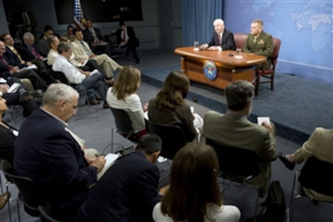 Secretary of Defense Robert M. Gates and Vice Chairman of the Joint Chiefs of Staff Gen. James E. Cartwright, U.S. Marine Corps, speak with members of the Pentagon press corps during a press conference in the Pentagon on August 13, 2009.  