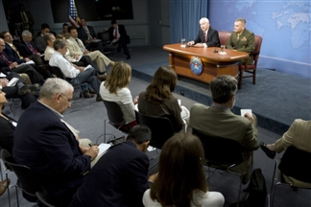 Secretary of Defense Robert M. Gates and Vice Chairman of the Joint Chiefs of Staff Gen. James E. Cartwright, U.S. Marine Corps, speak with members of the Pentagon press corps during a press conference in the Pentagon on August 13, 2009.  