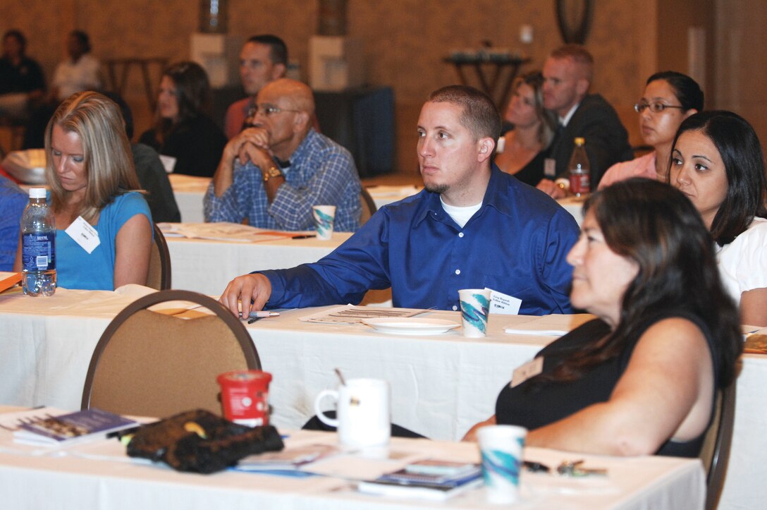 Yellow Ribbon attendees listen to a TRICARE briefing on the benefits of enrolling in the TRICARE Standard, Extra, Prime or Reserve Select programs. Not planning for health care can eat away your savings and could possibly leave you uninsurable, according to briefer Wendy Pritt. Other briefers discussed how to protect your identity, how to obtain a job in this tight economy, marriage and family resources, wills and powers of attorney, Homeowner’s Assistance Program and the Servicemembers Civil Relief Act. (U.S. Air Force Photo by Tech. Sgt. Carolyn Erfe)